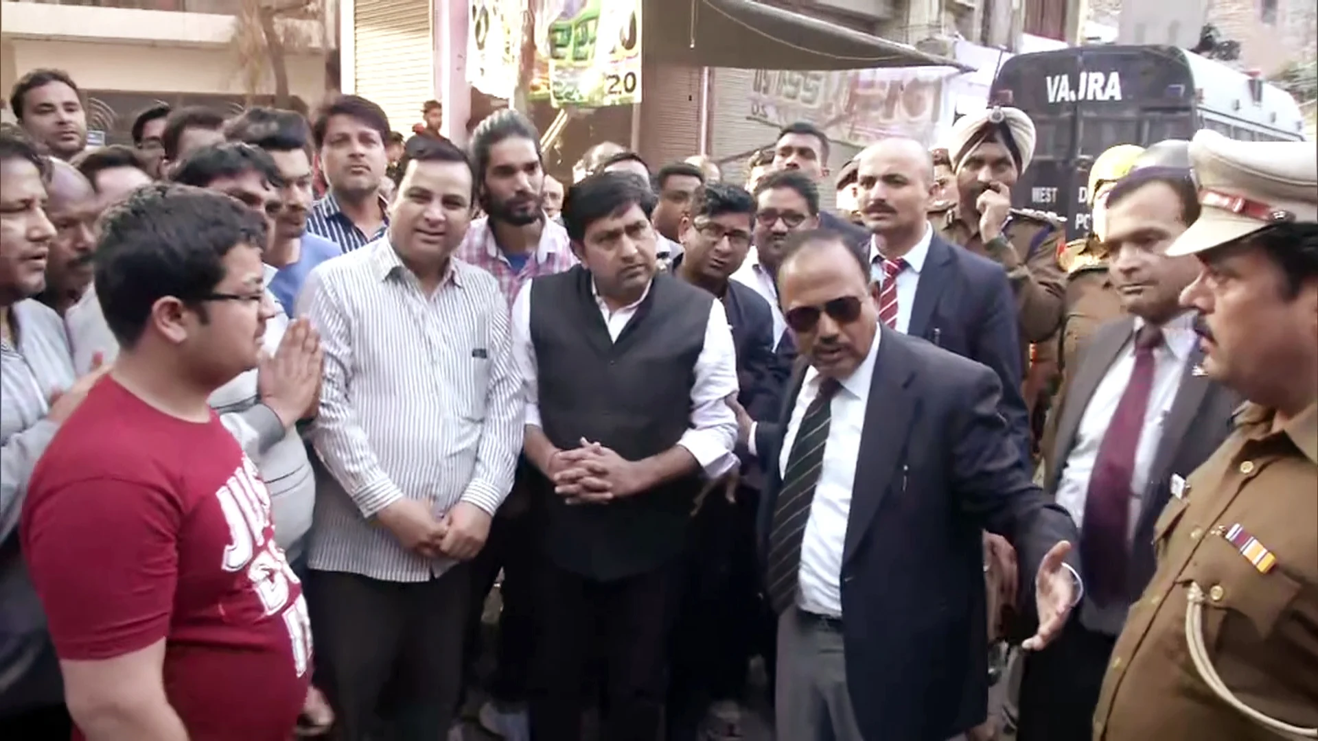 National Security Advisor (NSA) Ajit Doval interacts with the local residents of Maujpur, in New Delhi on Wednesday.