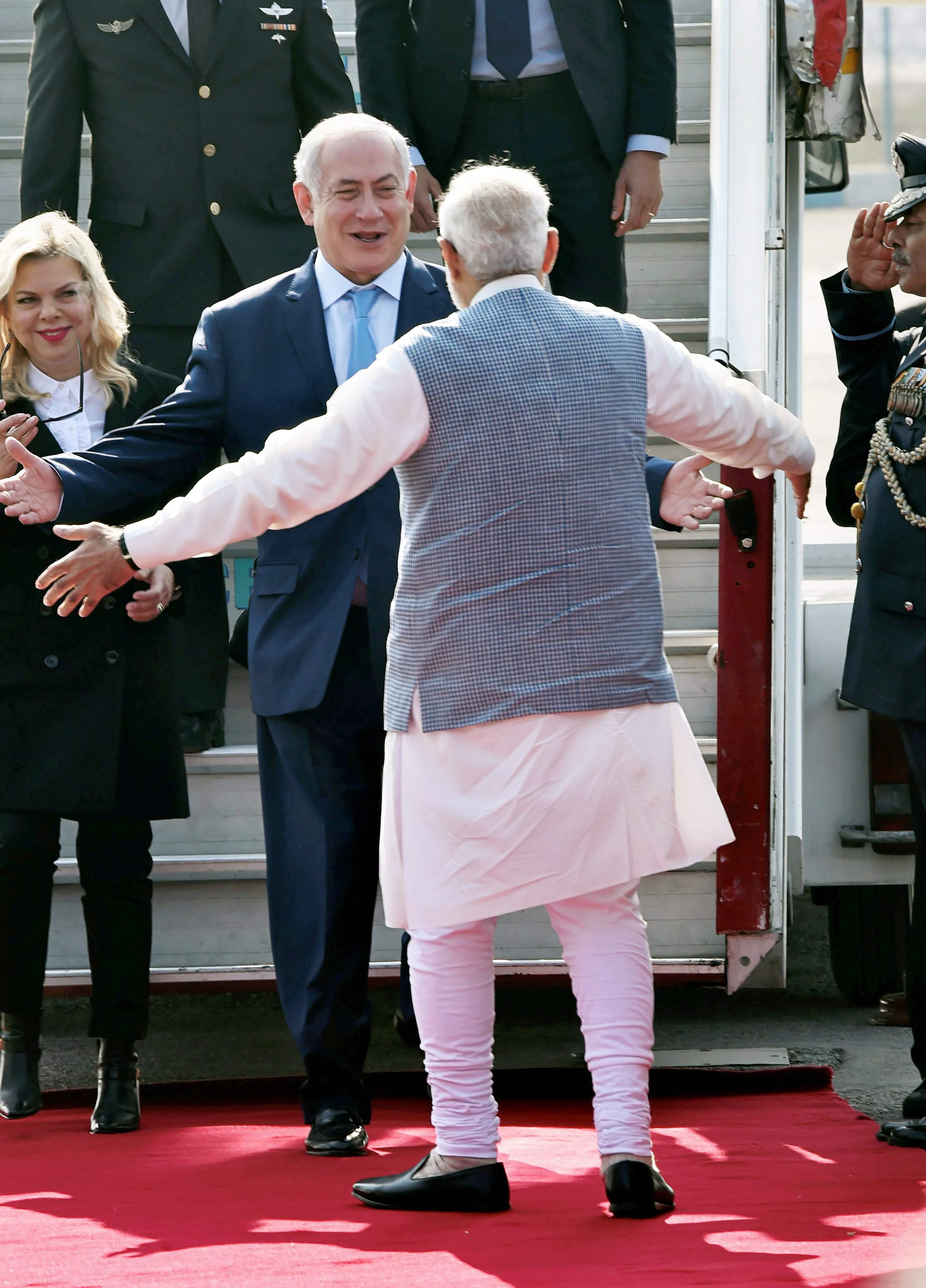 Prime Minister Modi broke protocol to personally receive Benjamin Netanyahu with a hug as he arrived in India for a six-day visit. He also shook hands with Netanyahu's wife Sara.