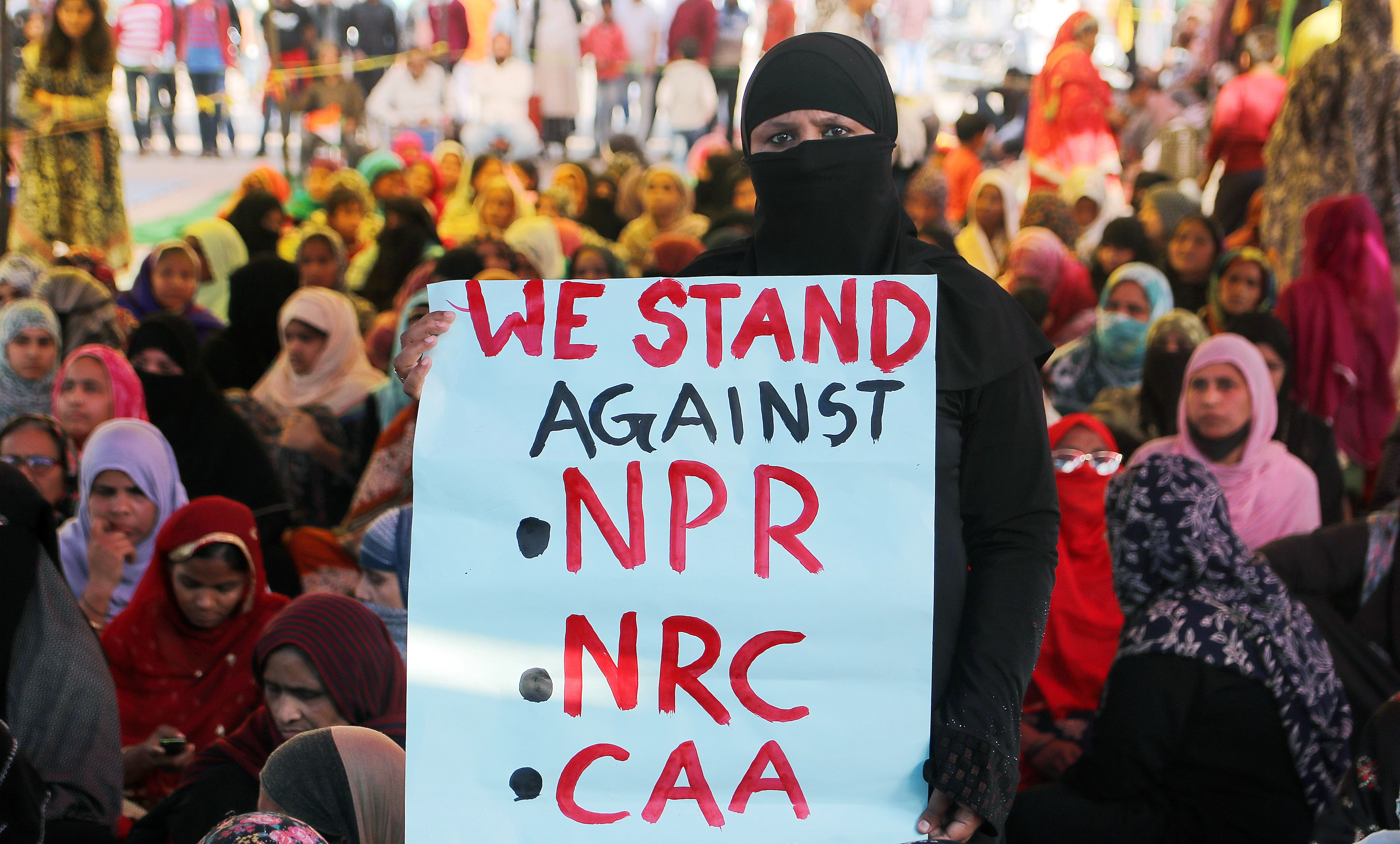 Demonstrators take part in a protest against the Citizenship Amendment Act and NRC at Shaheen Bagh, in New Delhi on Wednesday.