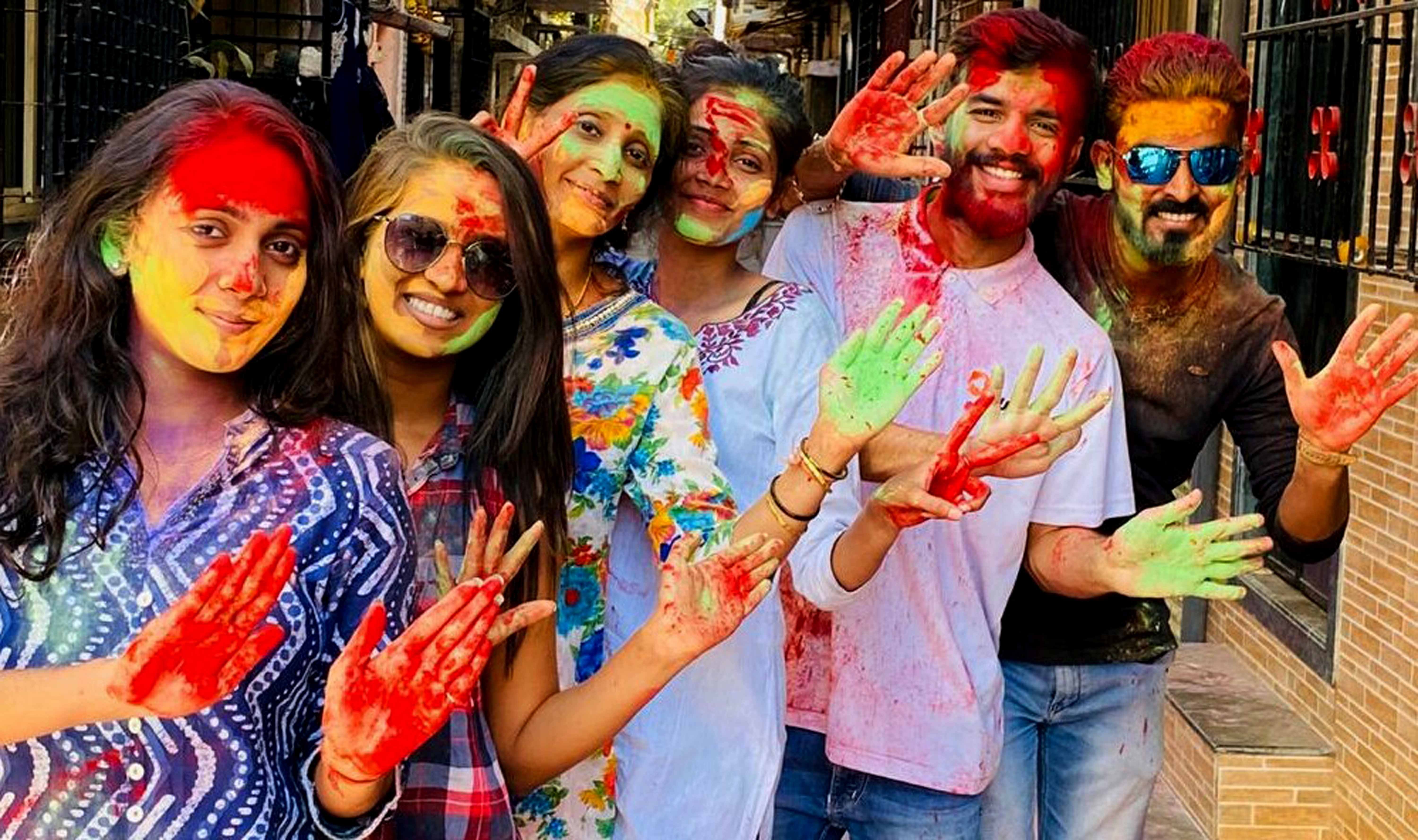 People celebrate Holi at Gorai in Mumbai's Borivali