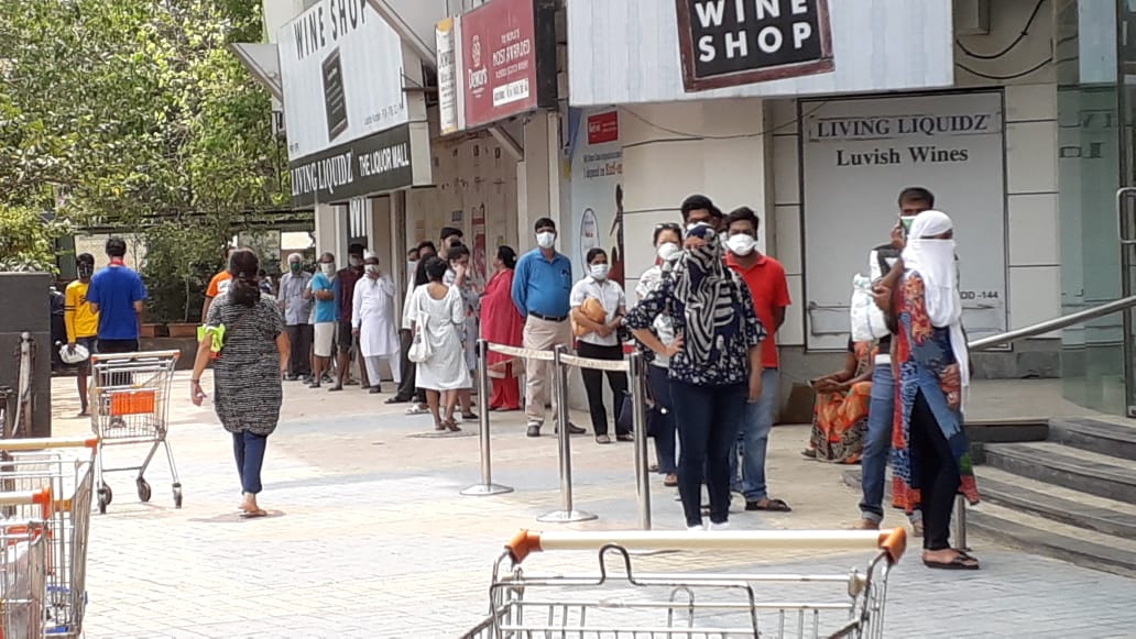 People standing in queue at Star bazar in Andheri West