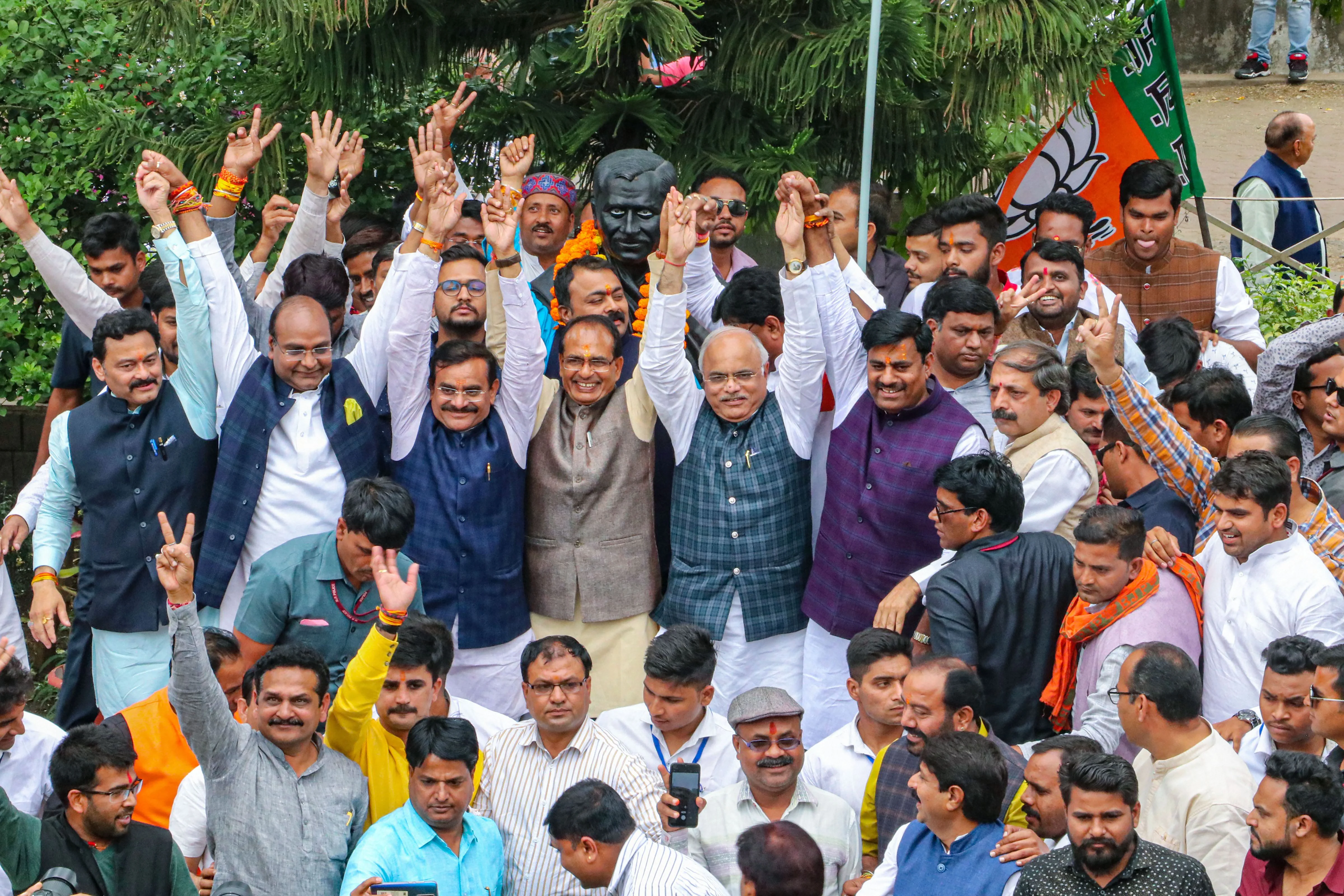 BJP leaders Shivraj Singh Chouhan, VD Sharma, Gopal Bhargava and others celebrate after Madhya Pradesh Chief Minister Kamal Nath resigned from his post, at state party headquarters in Bhopal, Friday, March 20, 2020.