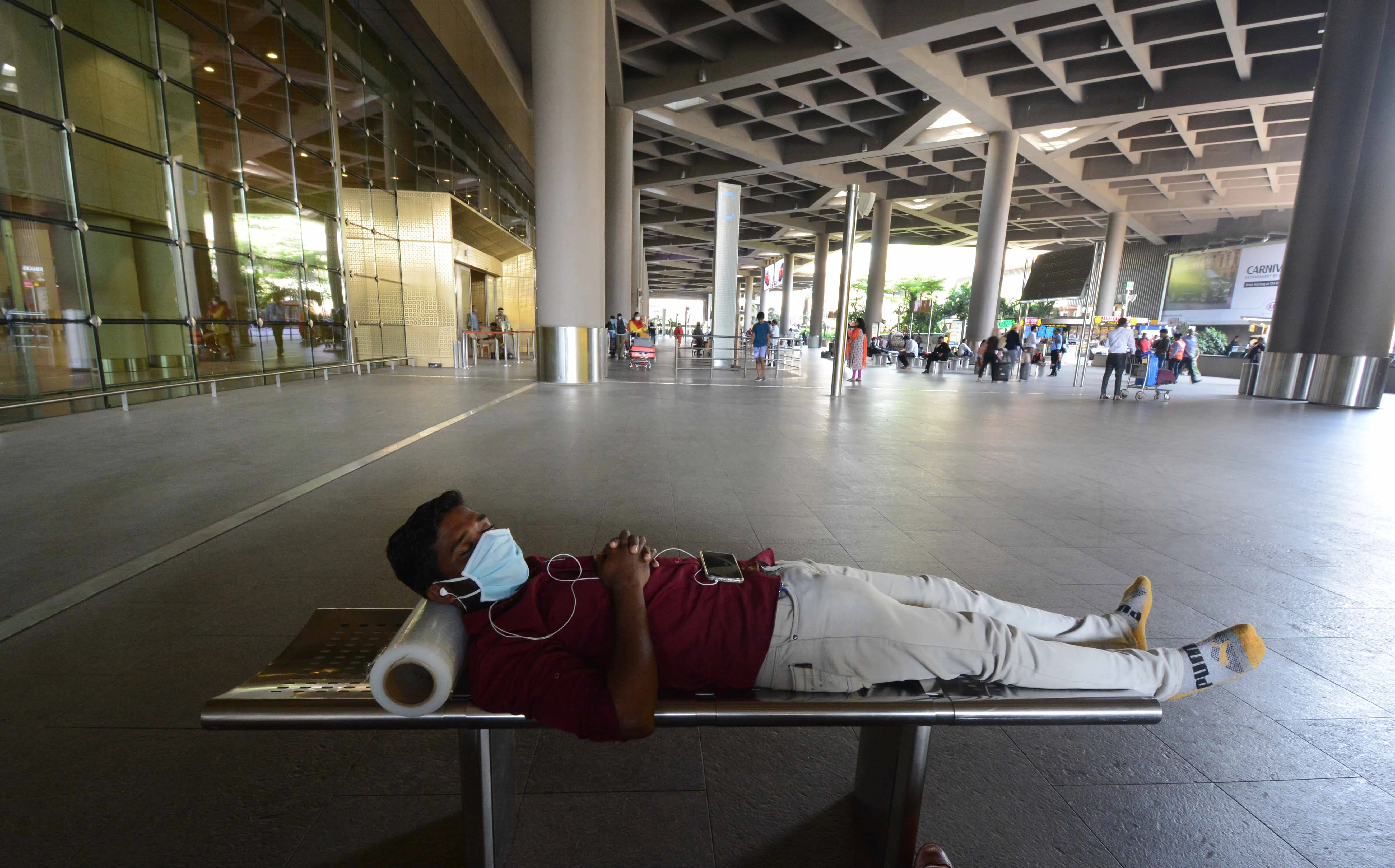 A cargo worker relaxes at the Mumbai International Airport