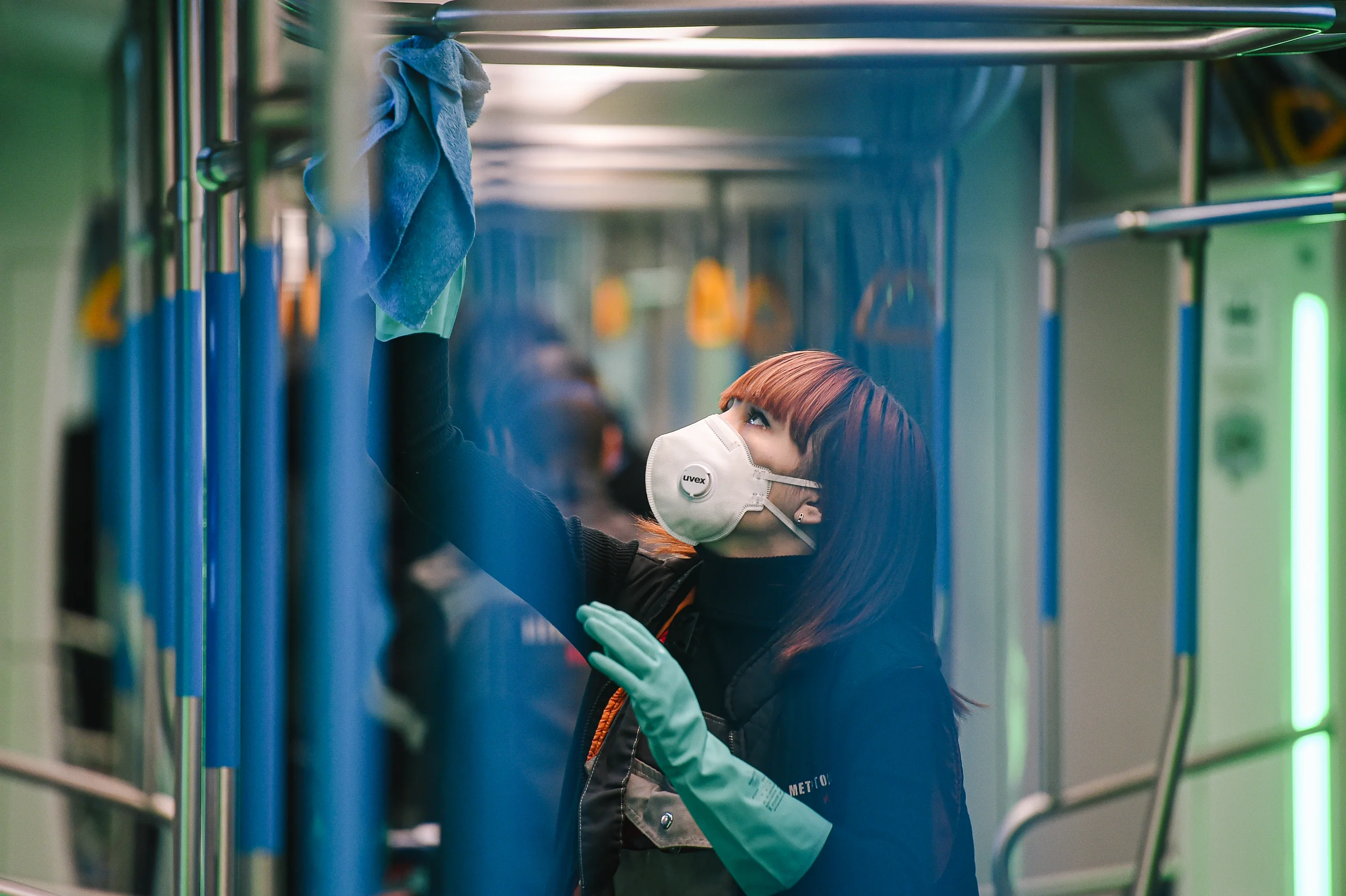 A subway worker cleans the handrails as a part of the disinfection procedure in Moscow, Russia, on March 16, 2020.
