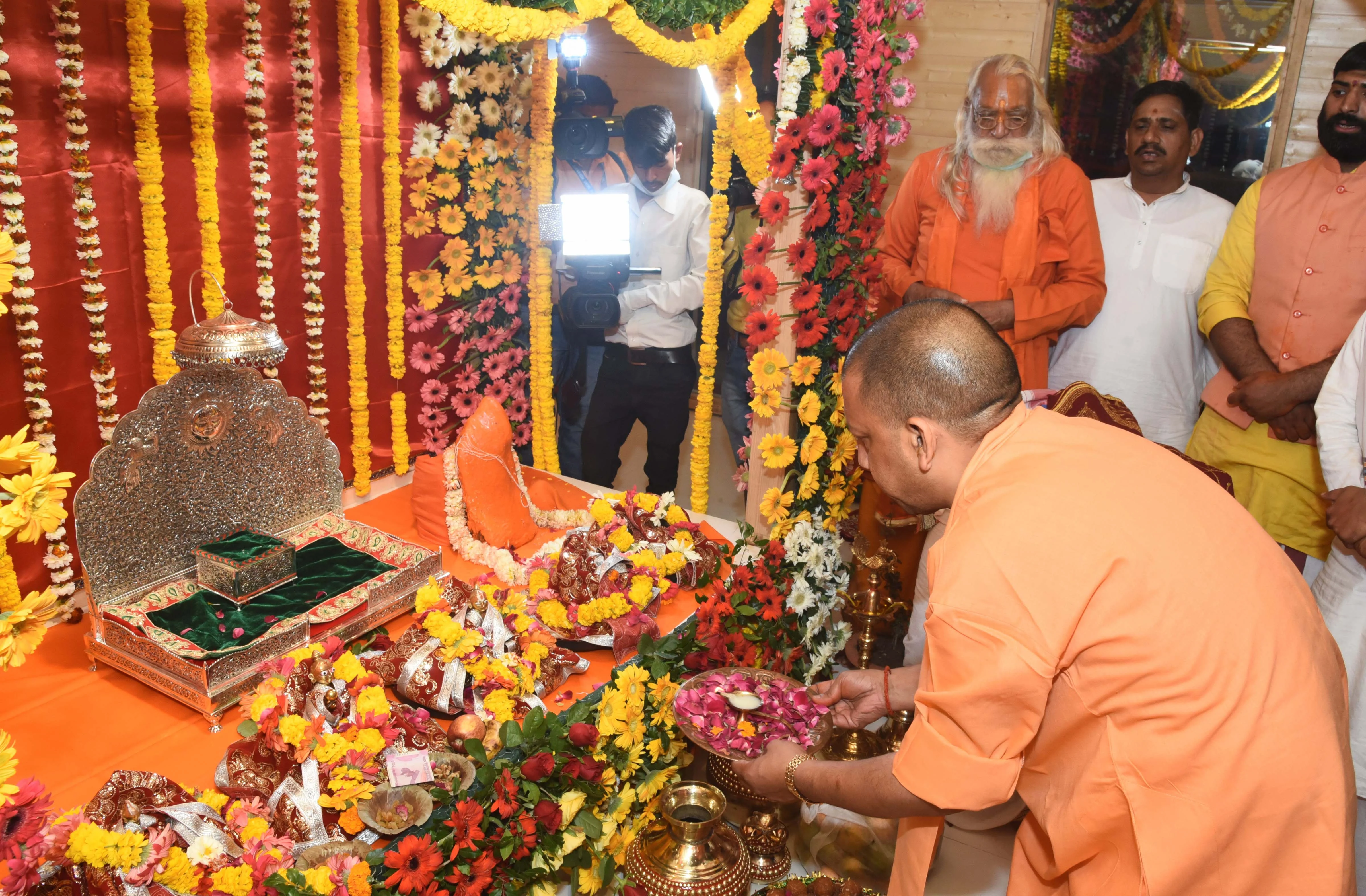 Uttar Pradesh Chief Minister Yogi Adityanath offers prayers at Asthai Temple in Ayodhya, Wednesday, March 25, 2020. Social distancing was maintained as the CM shifted the idol of Ramlala from the makeshift temple to a new structure near Manas Bhawan, in Ayodhya. There was no participation of the public.