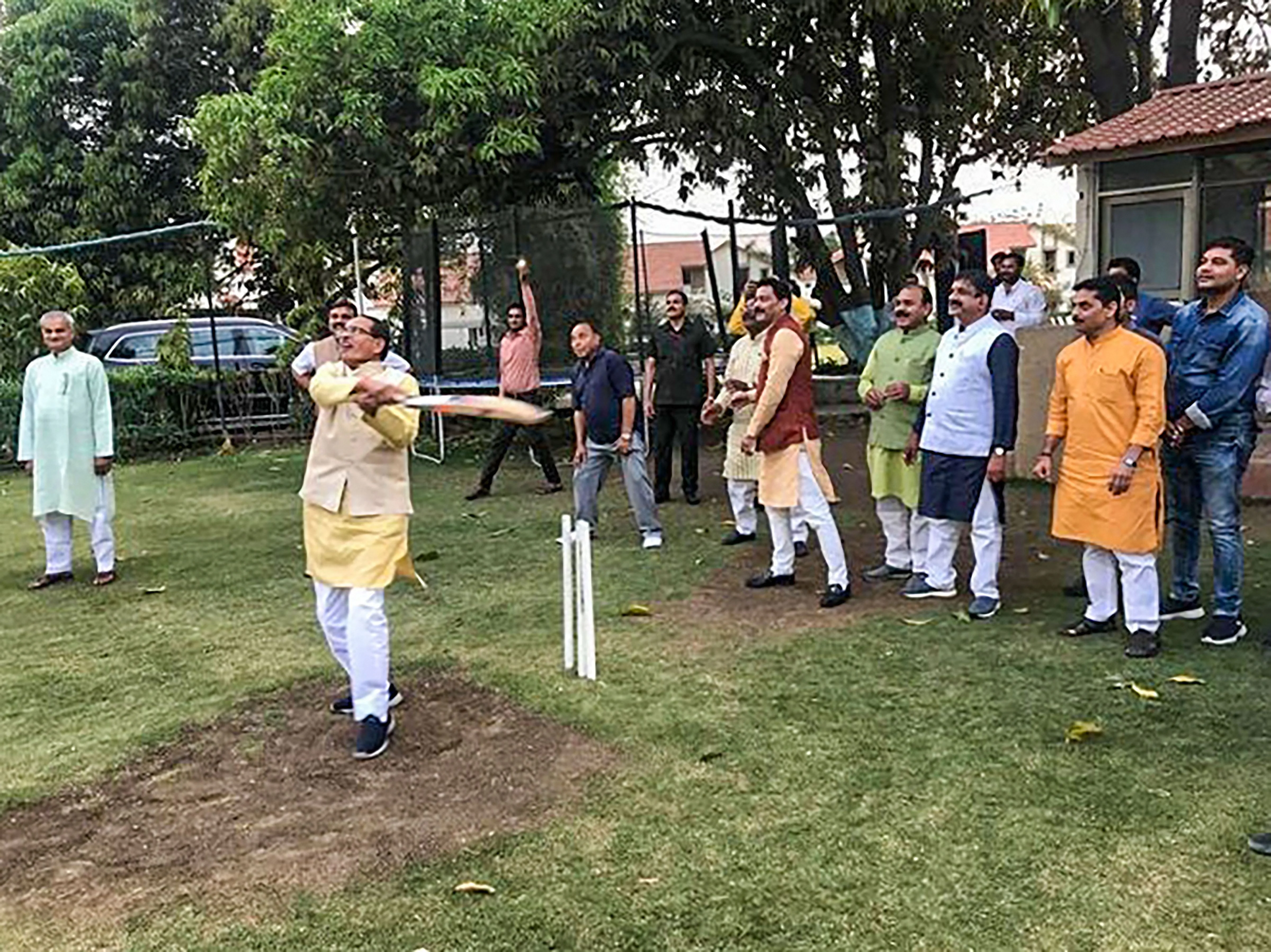 BJP leader Shivraj Singh Chouhan plays cricket amid Madhya Pradesh political turmoil, in Bhopal on Wednesday, March 18, 2020.