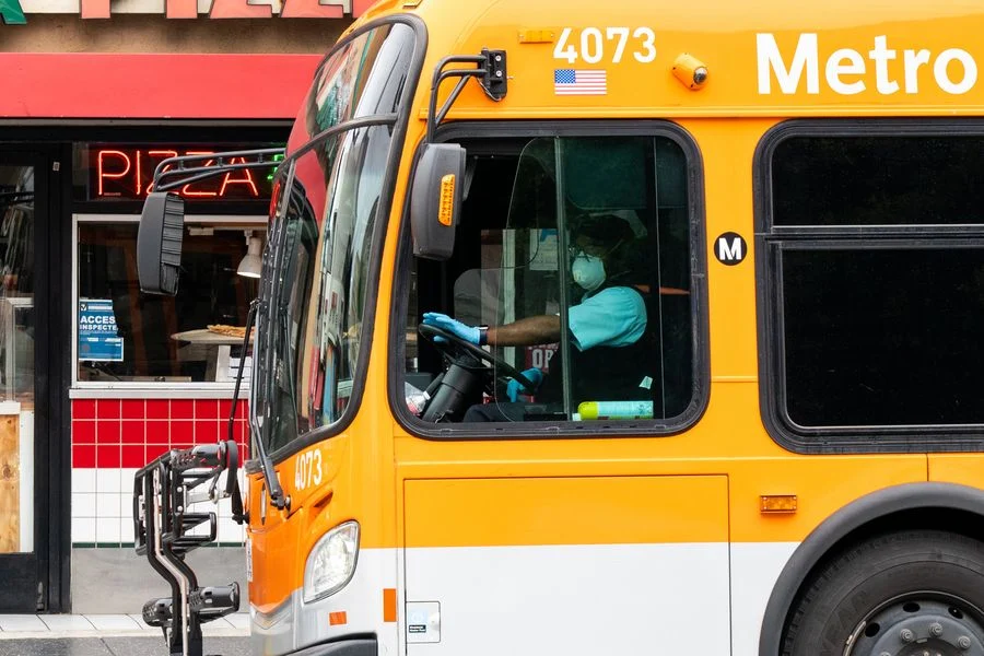 A bus driver wearing a face mask is seen in Los Angeles, California, the United States, March 20, 2020.