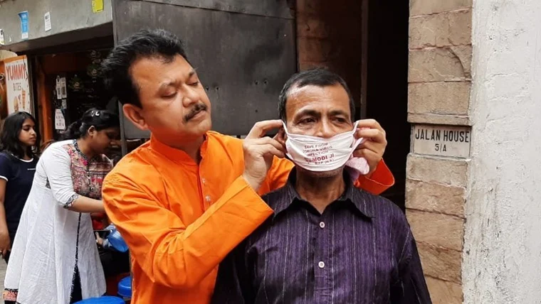 commas matter west bengal bjp leader distributes masks punctuations exercise