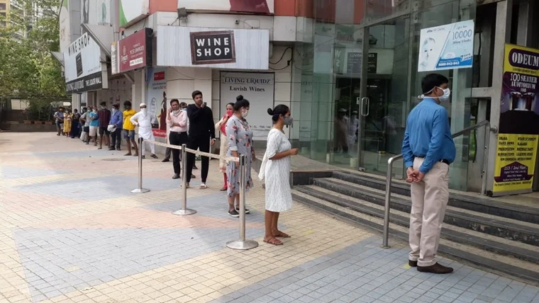 People standing in queue at Star bazar in Andheri West
