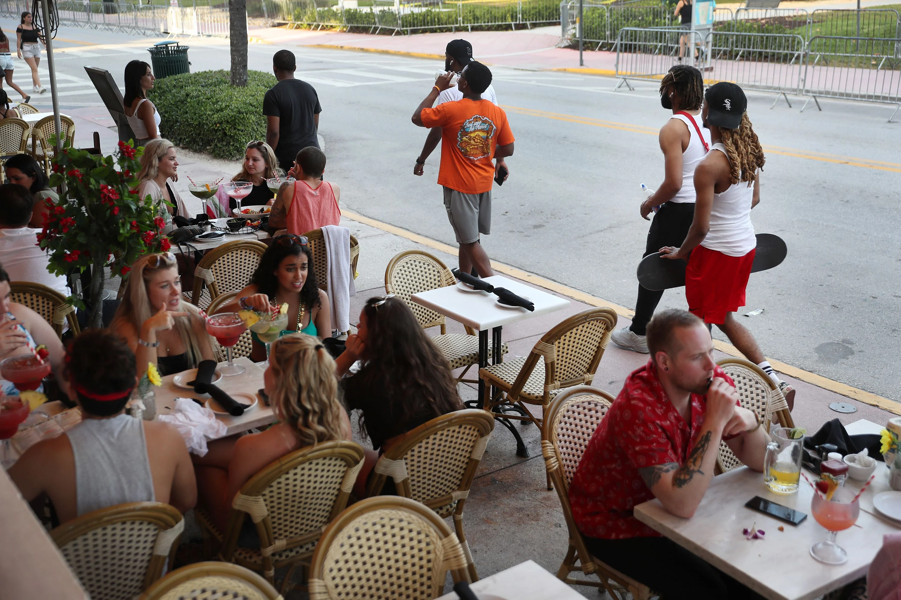 People eat at a restaurant along Ocean Drive in Miami Beach, Florida.