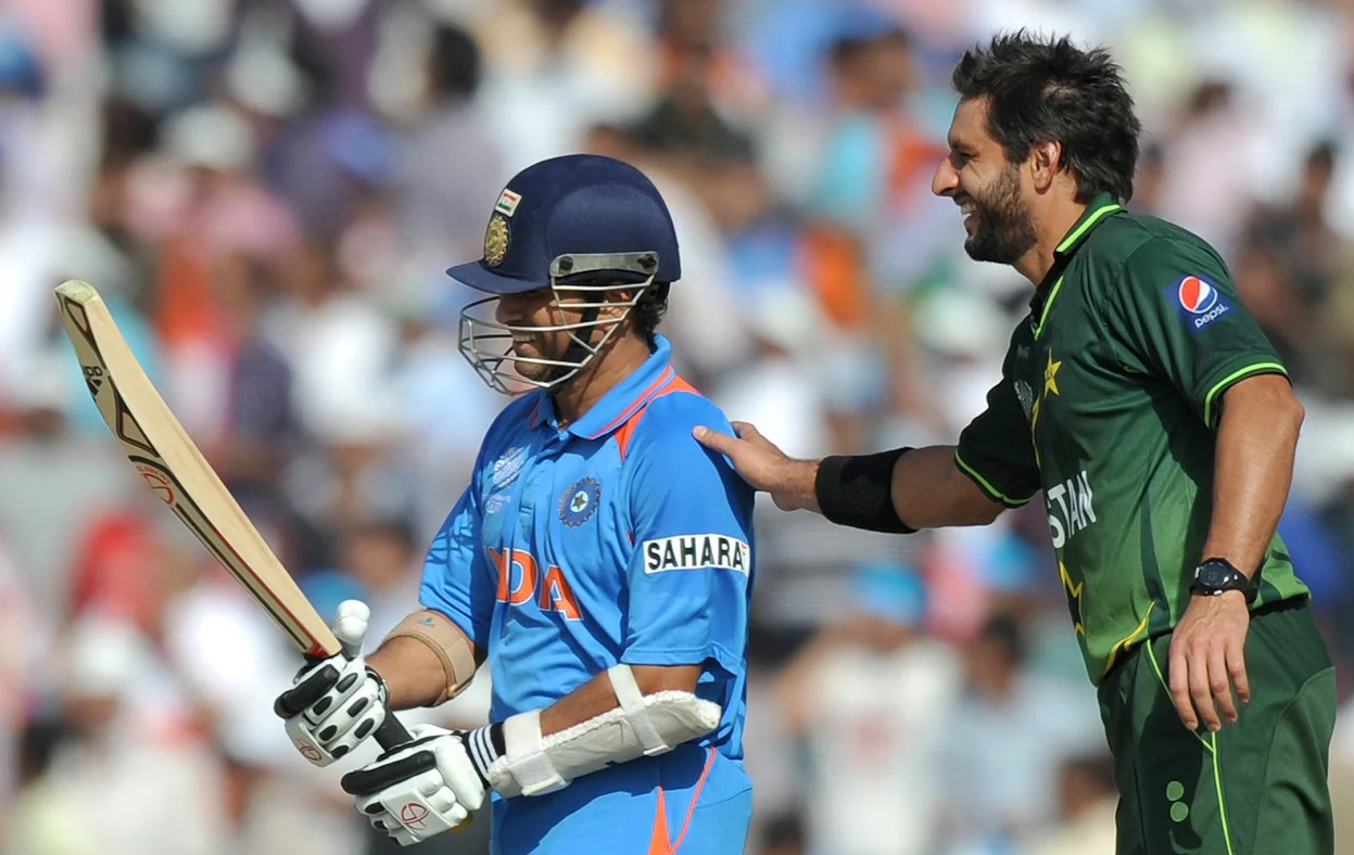 Pakistan's the then skipper Shahid Afridi pats Sachin Tendulkar