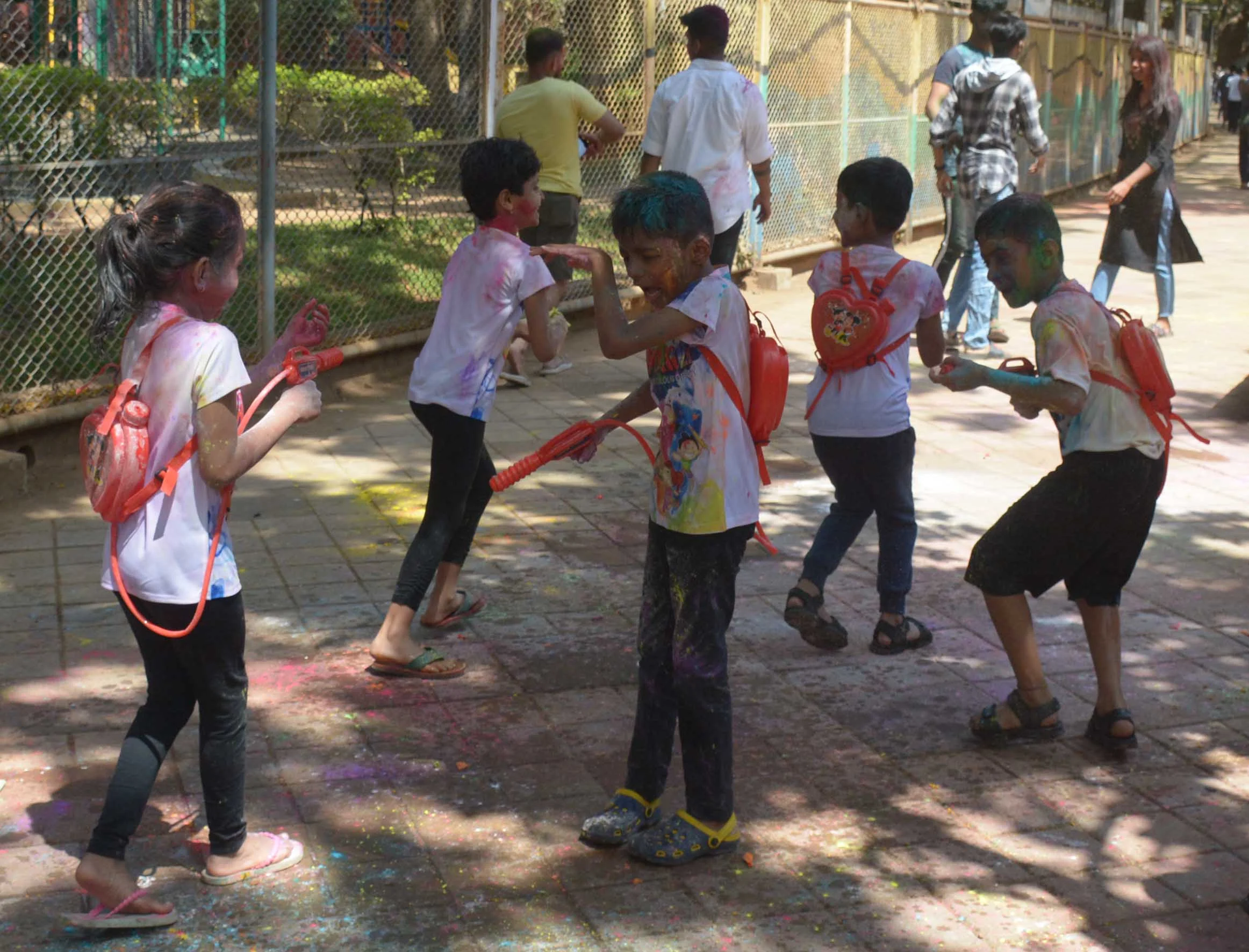 Children play with water guns in Mumbai
