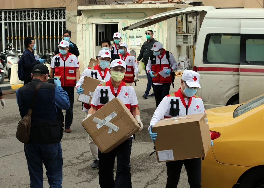 A Chinese team of health experts sent to provide assistance to contain the COVID-19 outbreak in Iraq work in Baghdad, Iraq, March 25, 2020.