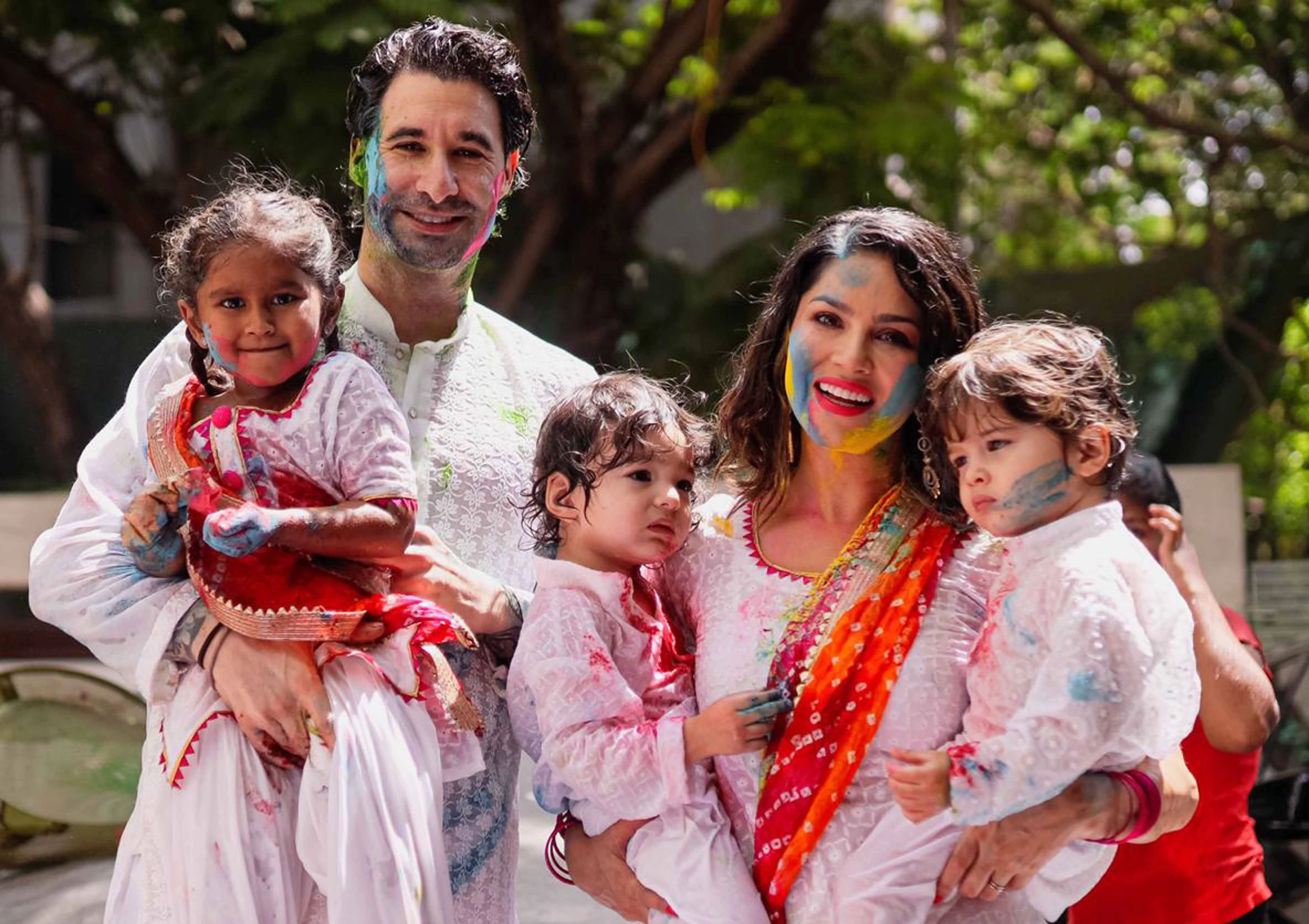 Actor Sunny Leone plays holi with her family in Mumbai's Juhu.