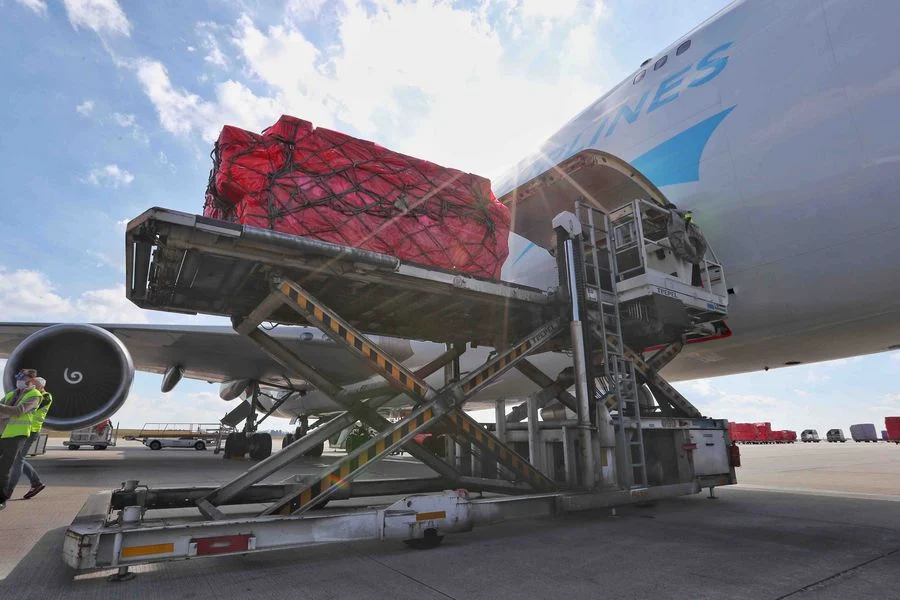 Medical materials from China arrive at the Liege airport in Belgium, on March 18, 2020. A batch of 1 million donated medical masks were flown in Belgium on March 18, en route to France. The medical supply was mobilized by two Chinese charities to help combat the spread of COVID-19.