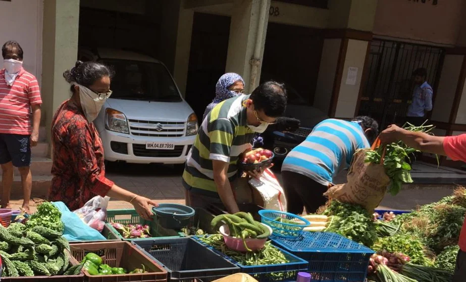In pics: Residents practice social distancing as societies arrange for vegetable vendors