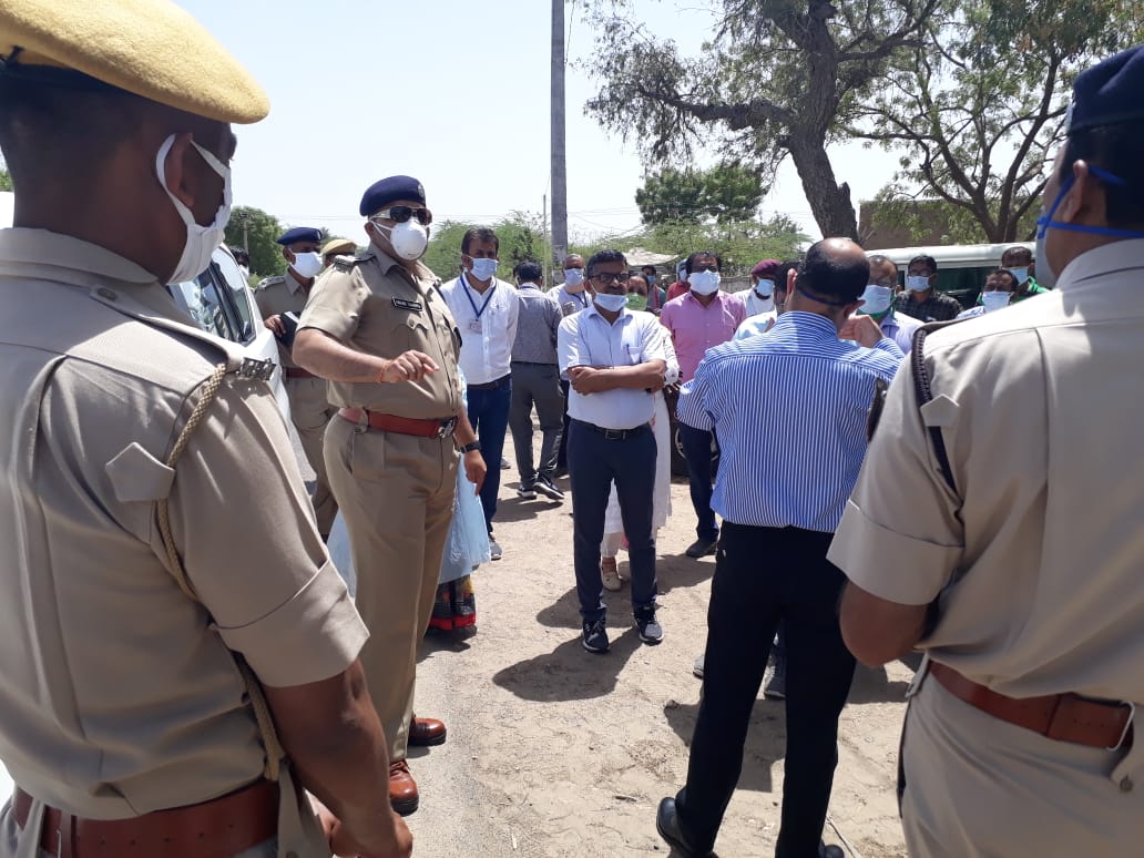 Administrative and police officers in Kitnoria village in Barmer