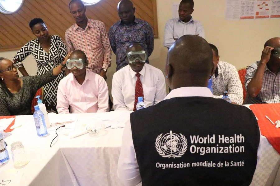 Medical staffs take part in a training exercise on COVID 19 prevention and infection control by the World Health Organization (WHO) at a hotel in Nairobi, capital of Kenya, March 4, 2020.