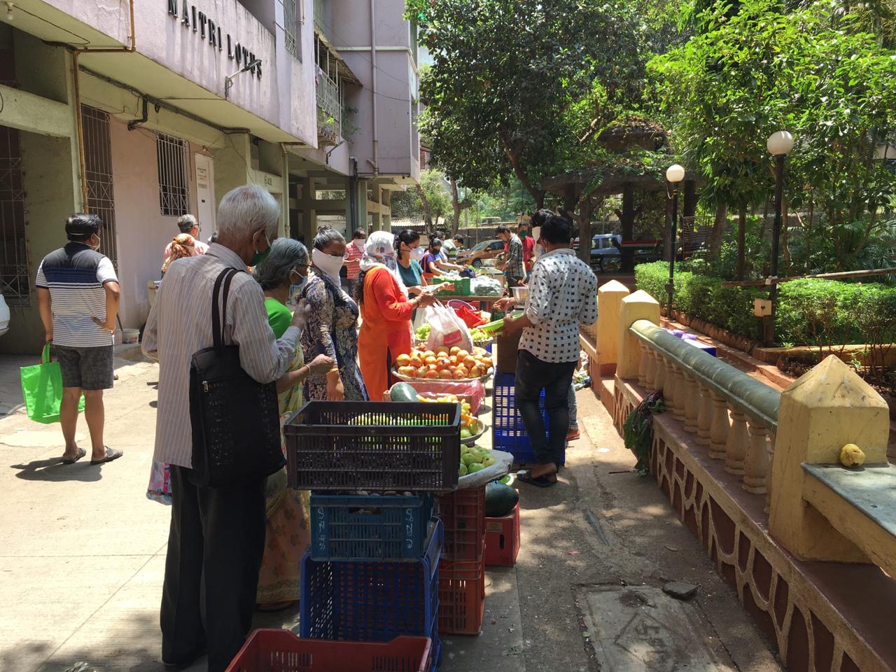 In pics: Residents practice social distancing as societies arrange for vegetable vendors