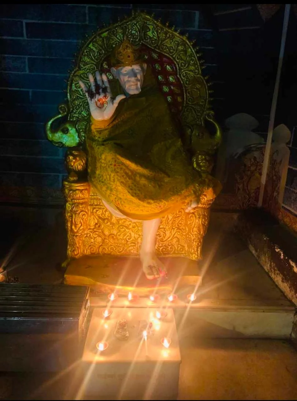 Chembur MLA Prakash Phaterpekar lights diyas in a Mandir outside his bungalow.