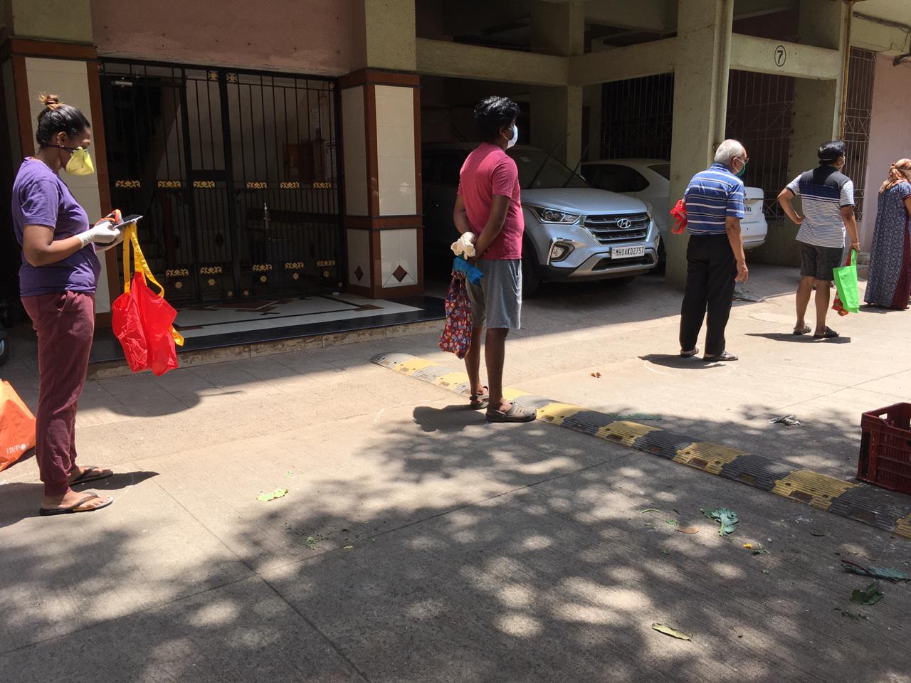 In pics: Residents practice social distancing as societies arrange for vegetable vendors