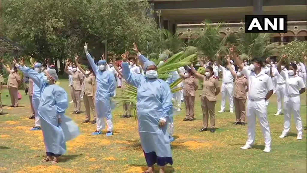 Indian Air Force helicopter showers flowers on the staff of Indian Navy’s INHS Asvini in Mumbai.