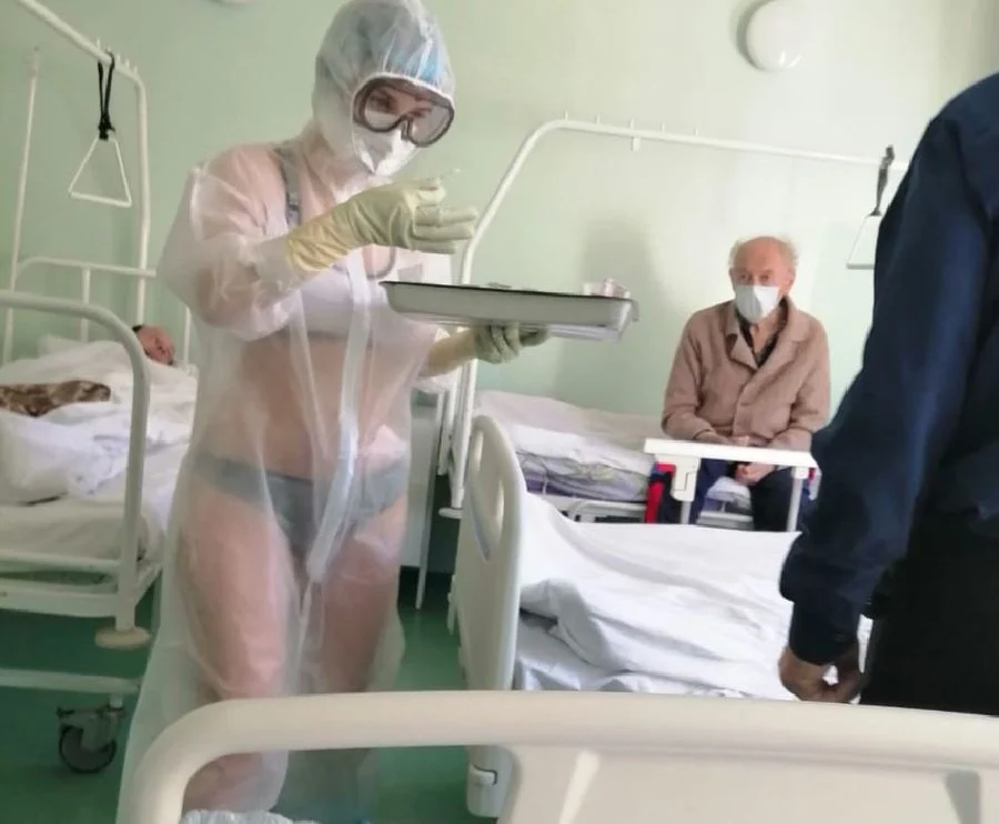 Russian nurse wears lingerie under PPE suit, says "it gets too hot for clothes"