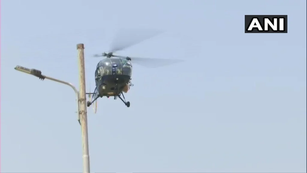 Indian Air Force helicopter showers flowers on the staff of Indian Navy’s INHS Asvini in Mumbai.