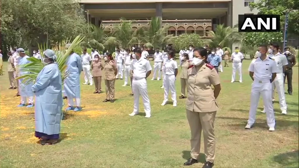 Indian Air Force helicopter showers flowers on the staff of Indian Navy’s INHS Asvini in Mumbai.