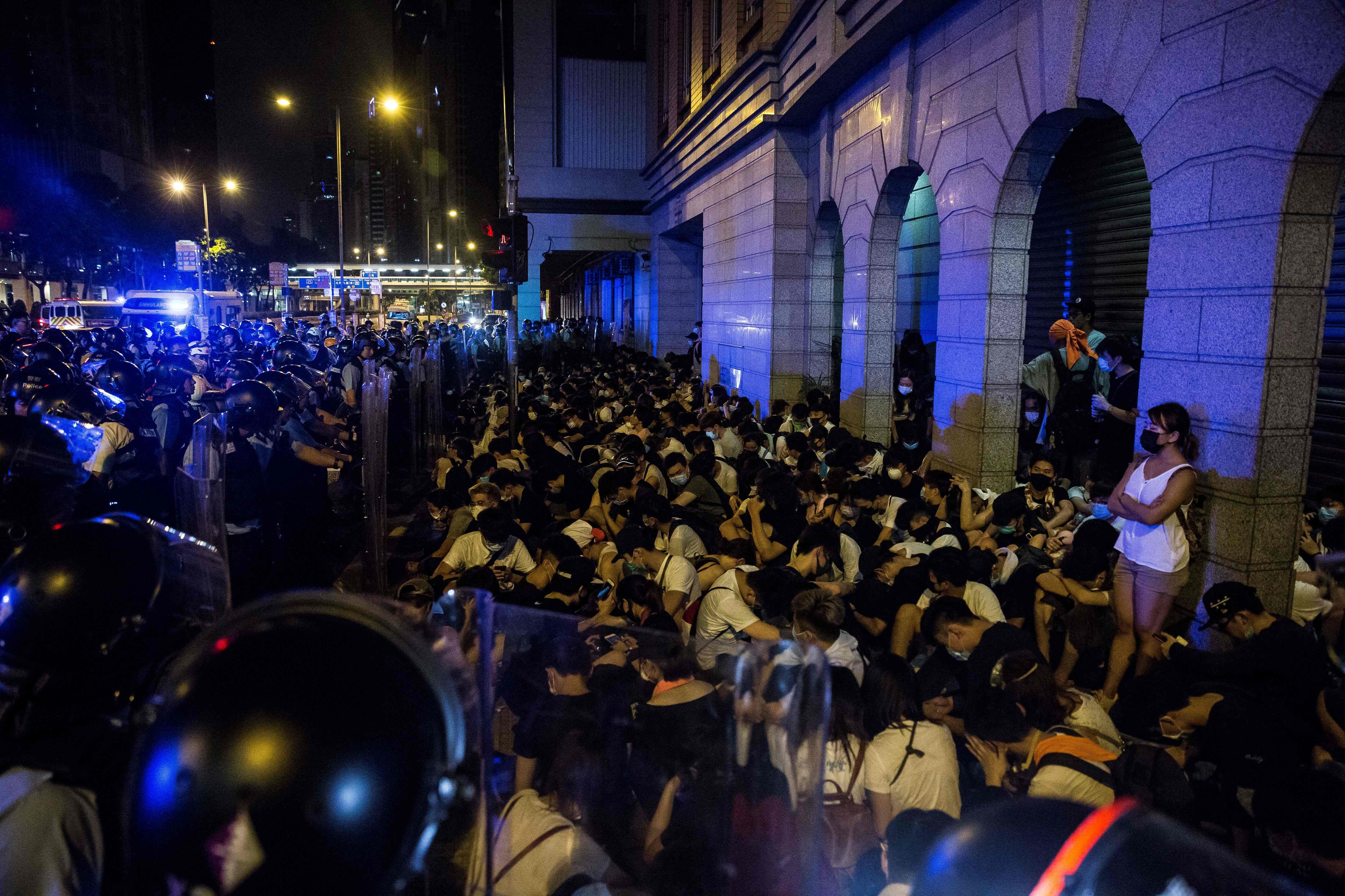 A file photo of protesters are detained by police after a rally against a controversial extradition law proposal in Hong Kong