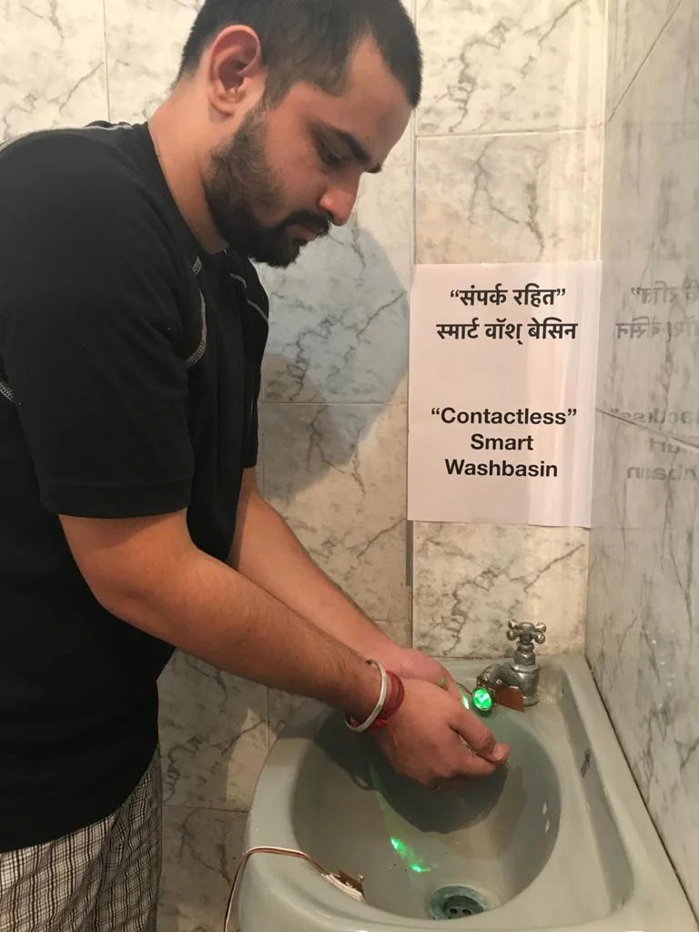Vaibhav using his Contactless Smart Wash Basin