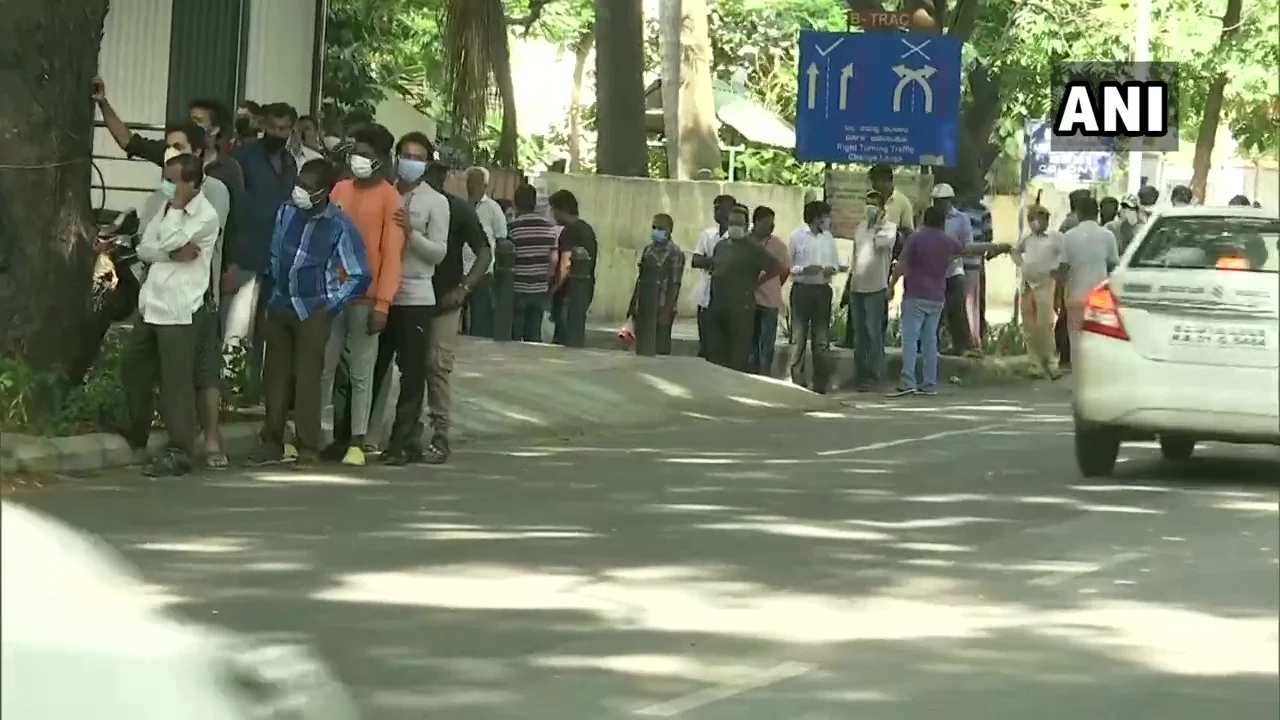 What social distancing? Booze lovers throng to liquor shops as MHA relaxes rules on sale of alcohol; Watch video