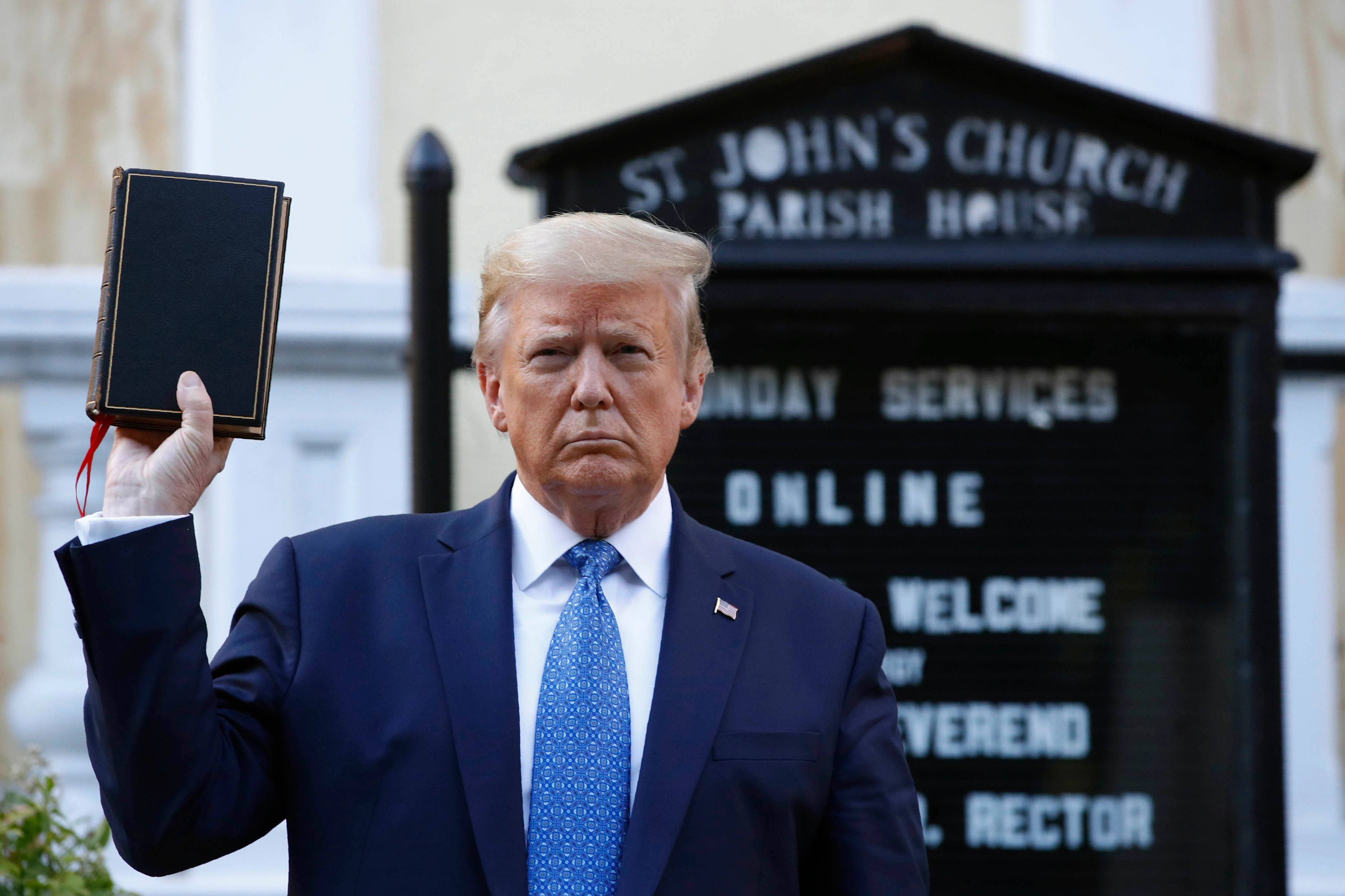 President Donald Trump holds a Bible as he visits outside St. Johns Church across Lafayette Park from the White House Monday, June 1, 2020, in Washington. Part of the church was set on fire during protests on Sunday night