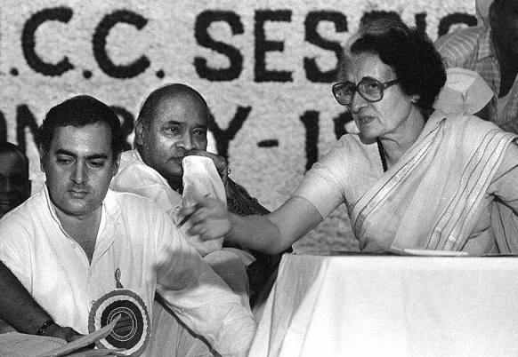 Indira and Rajiv Gandhi, with Rao in the background.