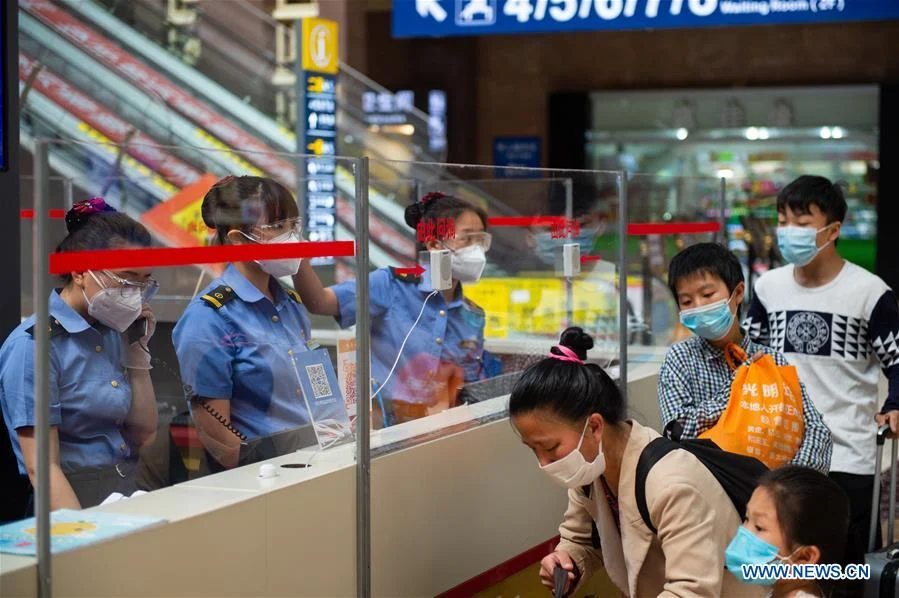 Passengers are seen at Beijing Railway Station in Beijing, capital of China, June 18, 2020. Following the upgrade of emergency response to COVID-19 from Level III to Level II in Beijing, Beijing Railway Station has conducted strict measures to prevent and control the spread of the epidemic.