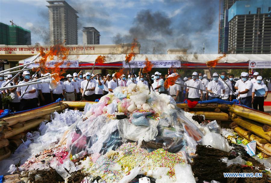 Officials set fire on illicit drugs during a ceremony in Phnom Penh, Cambodia, on June 26, 2020. Cambodia on Friday burned down 477.7 kg of illicit drugs to mark the International Day Against Drug Abuse and Illicit Trafficking, officials said.
