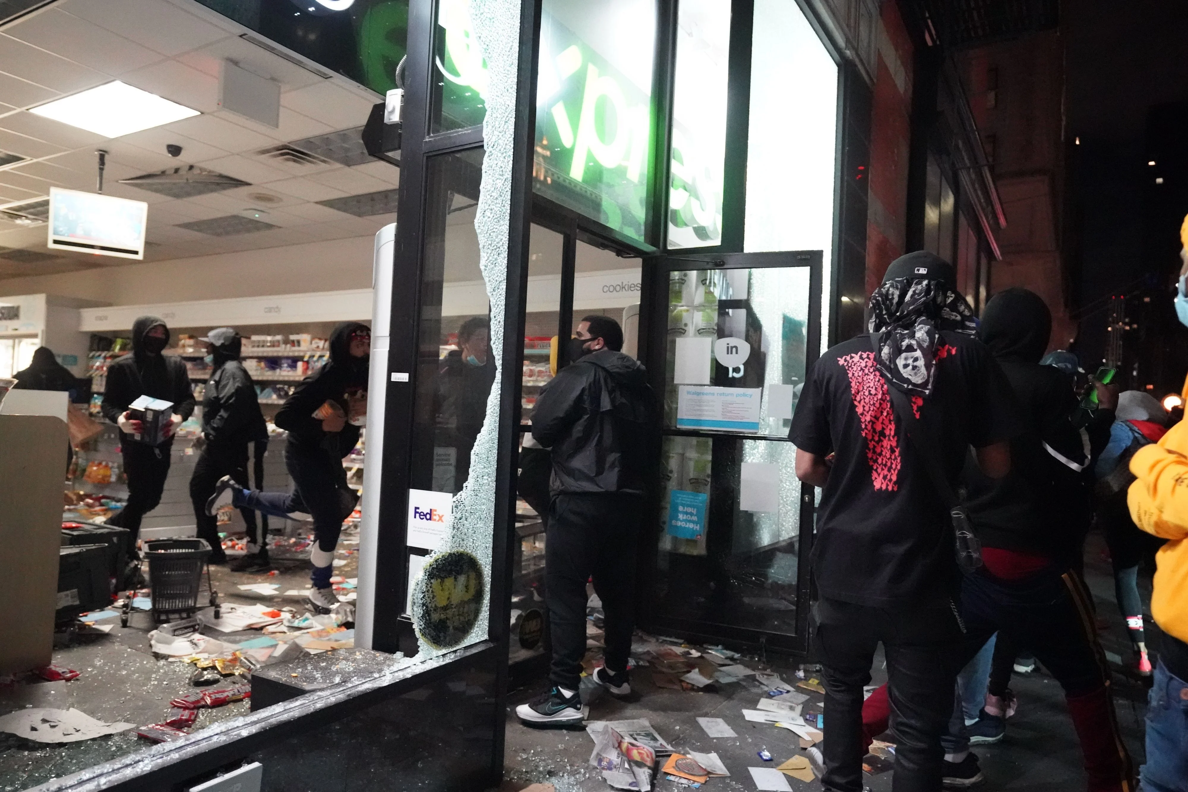 People loot a store during demonstrations over the death of George Floyd by a Minneapolis police officer on June 1, 2020 in New York