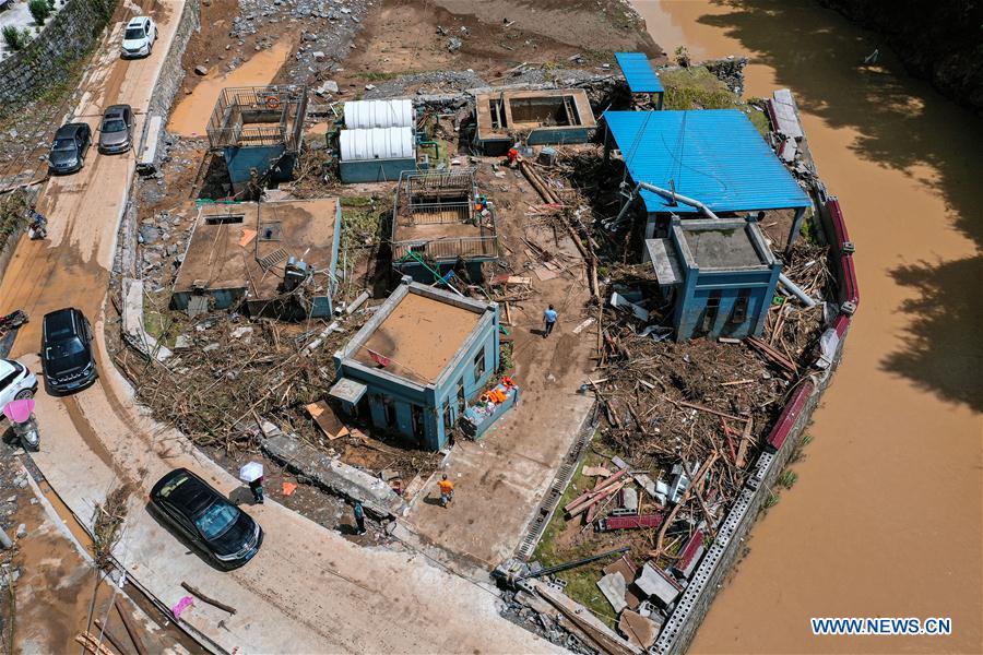 Aerial photo taken on June 13, 2020 shows houses devastated by flood in Bifeng Town of Zheng'an County in Zunyi, southwest China's Guizhou Province. Rain-triggered floods have affected more than 700,000 people in southwest China's Guizhou Province, with 29,500 individuals temporarily evacuated, authorities said Saturday.