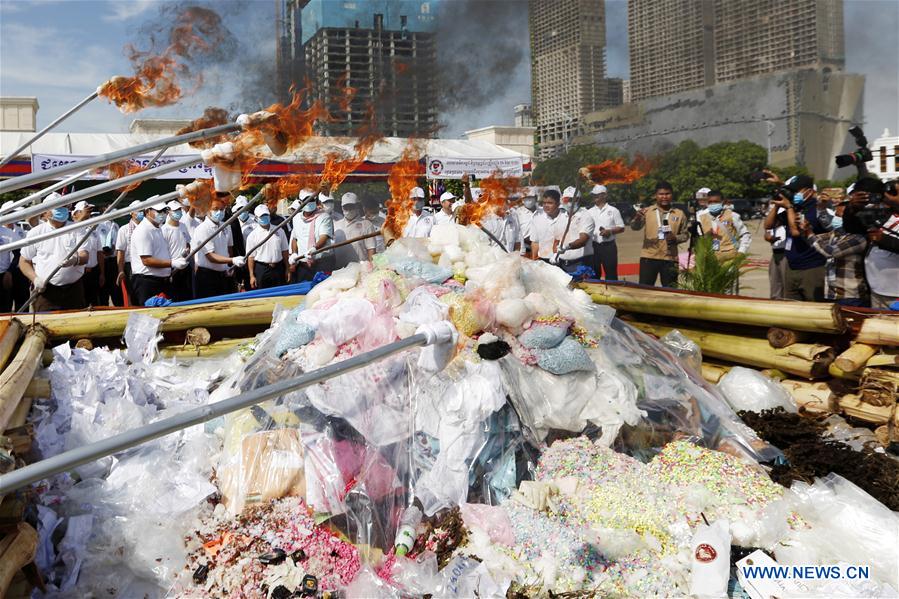 Officials set fire on illicit drugs during a ceremony in Phnom Penh, Cambodia, on June 26, 2020. Cambodia on Friday burned down 477.7 kg of illicit drugs to mark the International Day Against Drug Abuse and Illicit Trafficking, officials said.