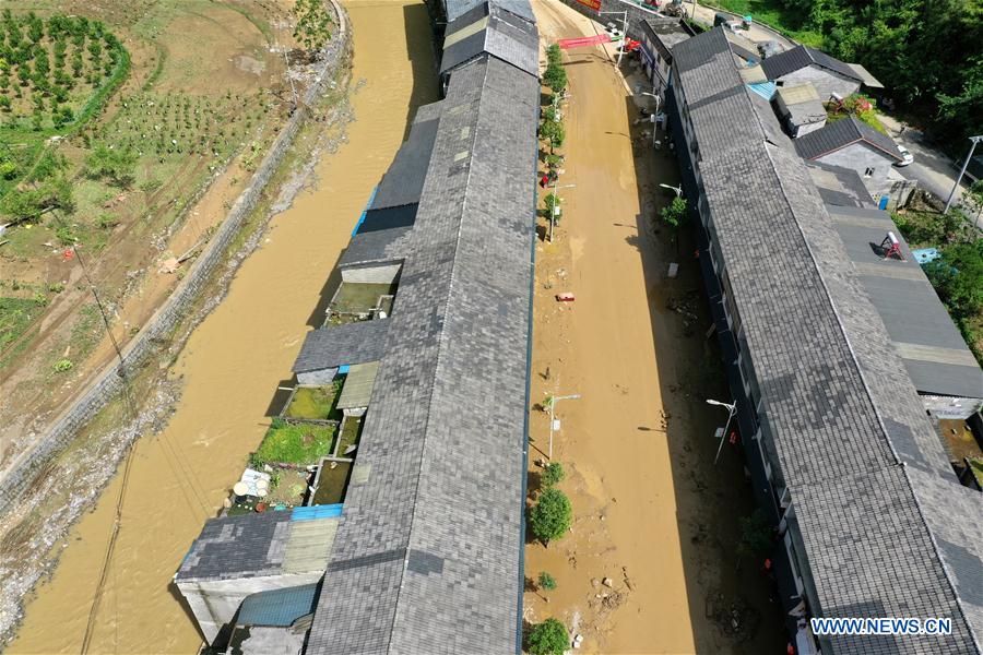 Aerial photo taken on June 13, 2020 shows silt covering the street at Bifeng Town of Zheng'an County in Zunyi, southwest China's Guizhou Province. Rain-triggered floods have affected more than 700,000 people in southwest China's Guizhou Province, with 29,500 individuals temporarily evacuated, authorities said Saturday.