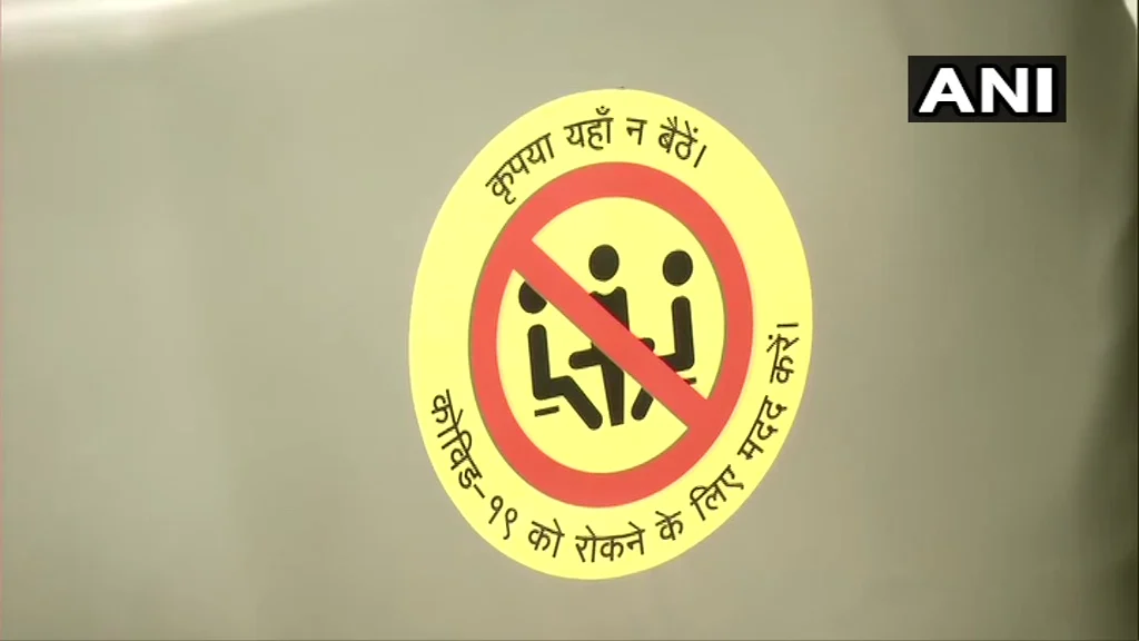 'Do not sit here’ stickers in Delhi Metro.