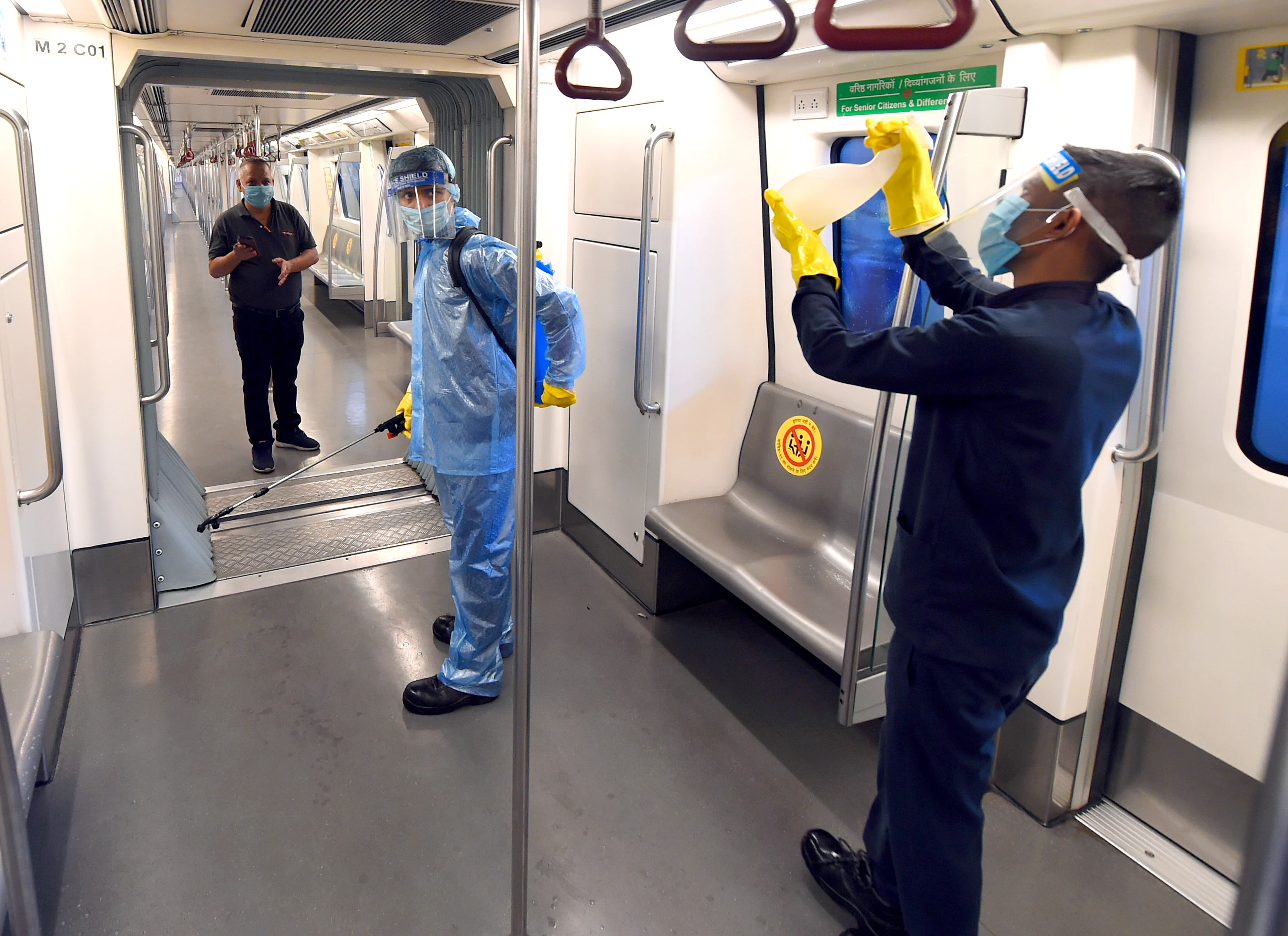 Preparation underway at the metro station as Delhi Metro rail gears up to resume services from Monday as part of Unlock4, in New Delhi on Sunday.