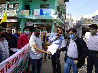 A memorandum addressed to the Prime Minister being handed over to the sub-divisional magistrate. 