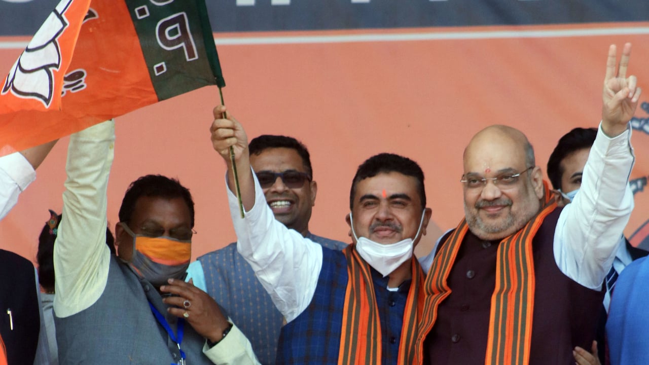 BJP leader Suvendu Adhikari with Union Home Minister Amit Shah during a public rally