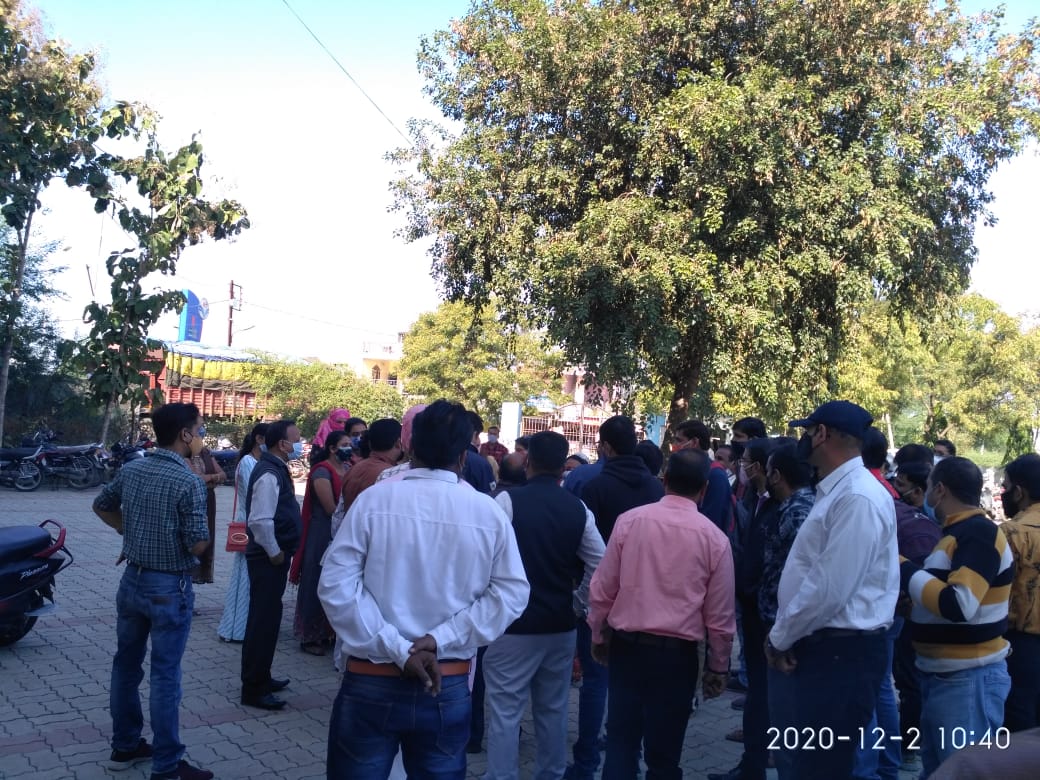 Parents outside St Thomas School in Ujjian on Wednesday
