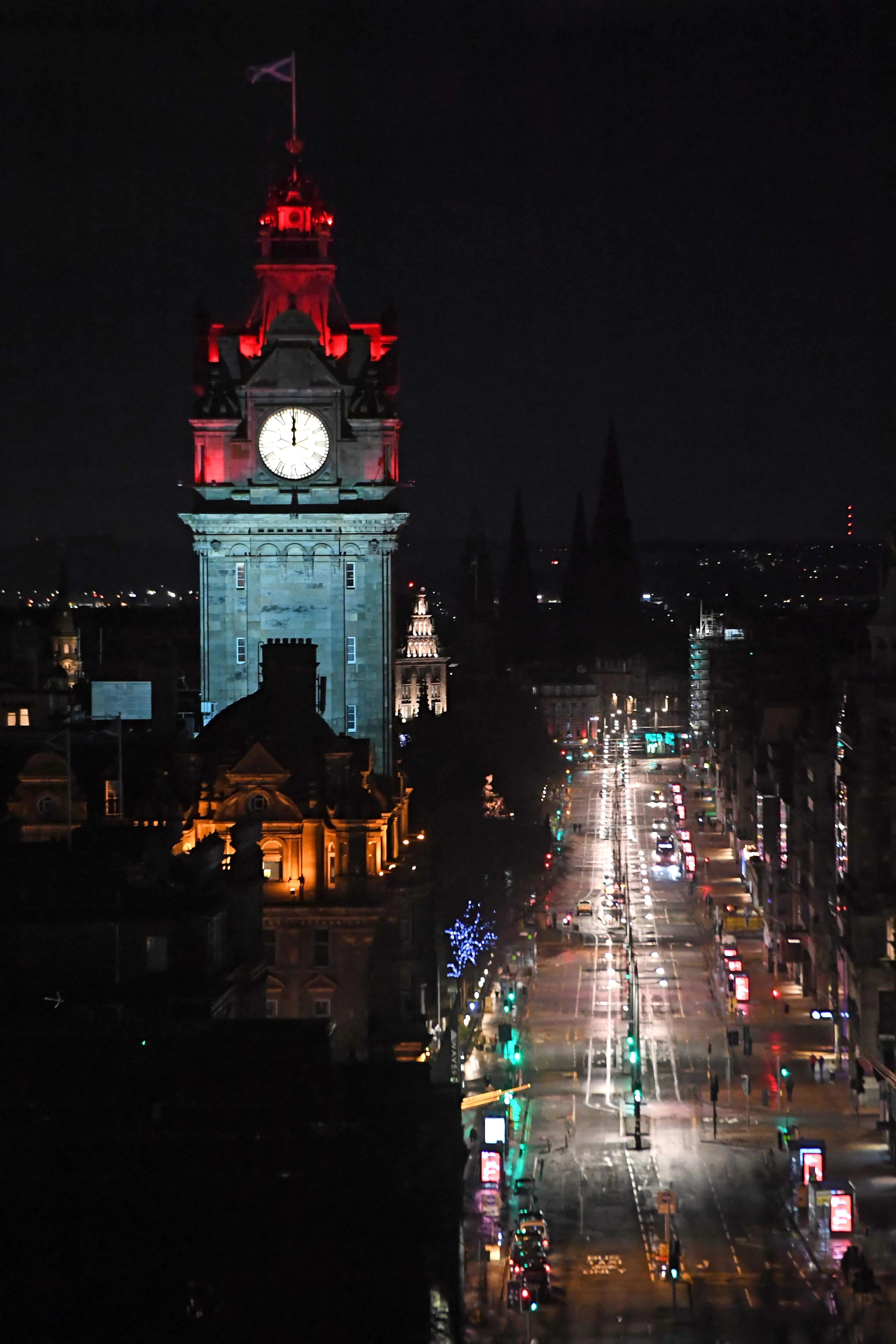 A near-deserted Princes Street in Edinburgh is pictured as the time passes midnight early on January 1, 2021 in Edinburgh, as the message to stay at home rather than going out to celebrate Hogmanay in the city is generally obeyed. - The streets of Scotlands capital are normally packed at Hogmanay, as people from around the world flock to see in the New Year in raucous style. As with so much else, the coronavirus outbreak has put paid the celebrations, putting Scots in a gloomy mood made worse by Britains parting of the ways with Europe.