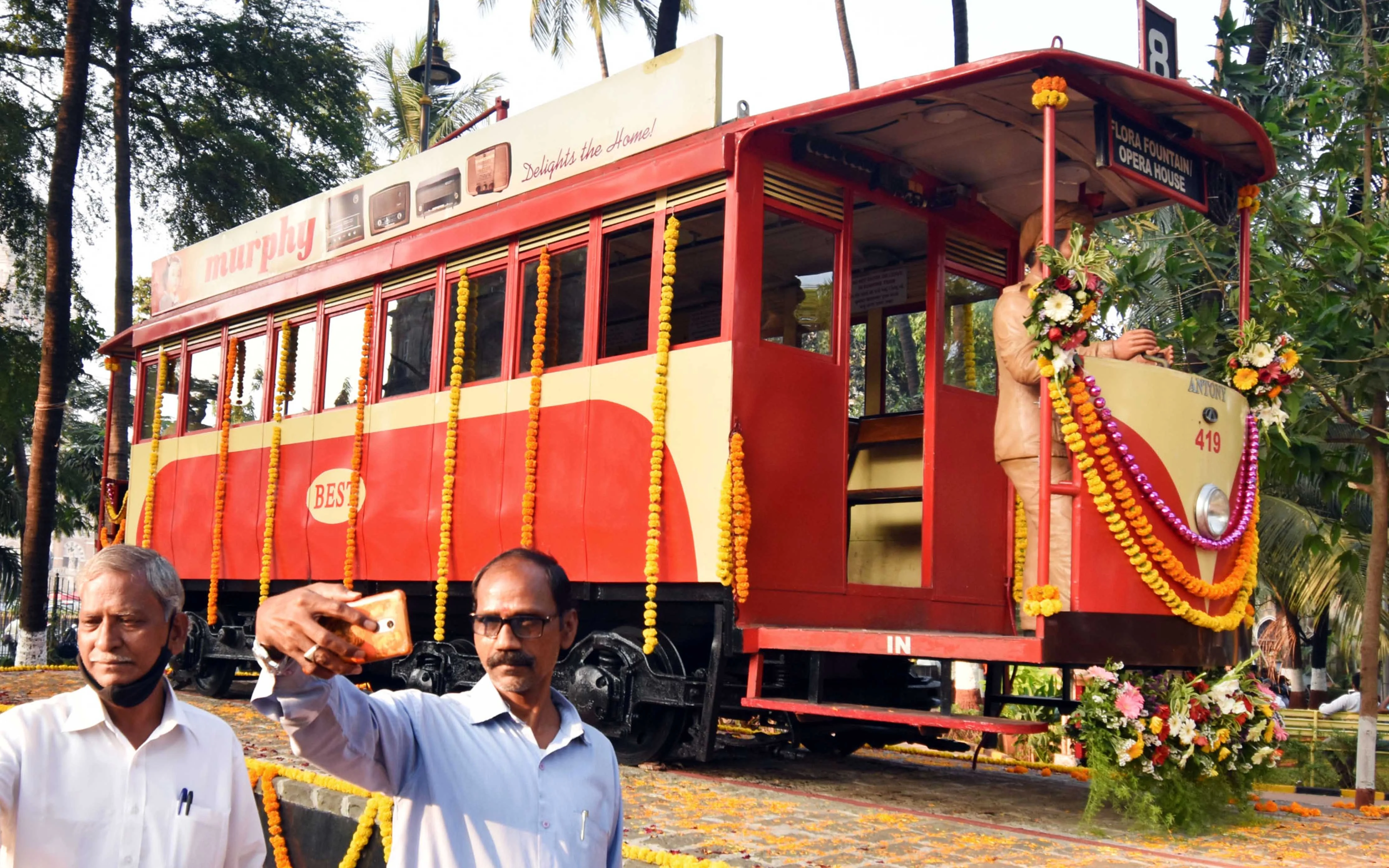 Mumbai: Visitors click selfies in front of a century-old tram bogie, inaugurated by BMC, at Bhatia Baug near CSMT in Mumbai, Thursday, Feb. 25, 2021.