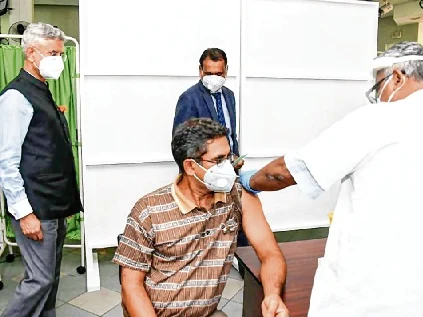 S Jaishankar watches as a medic gives a made-in-India Maitri shot to a Mauritius
resident, in Port Louis.