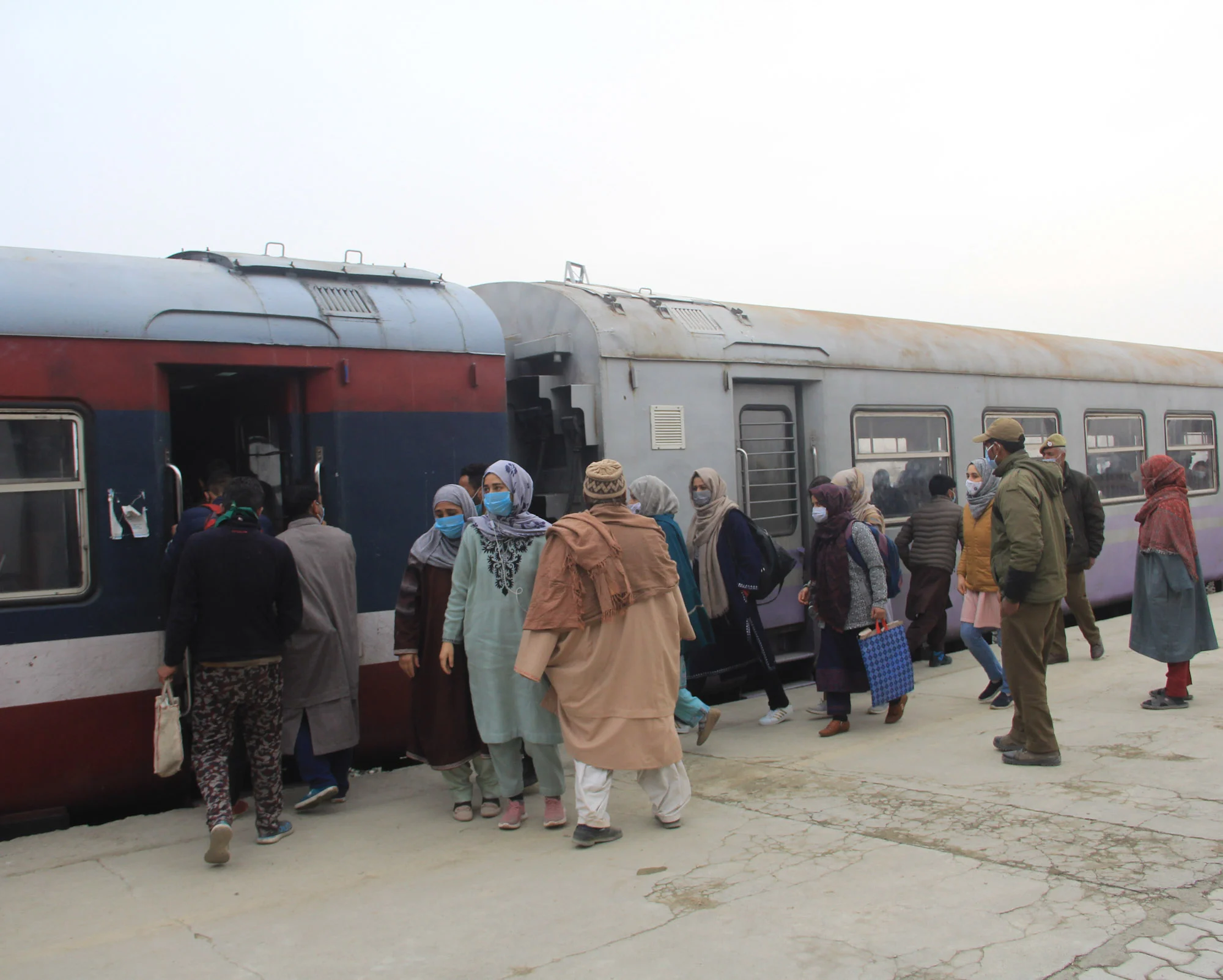 Passengers board a train as the rail service connecting Banihal to Baramulla resumed, in Kashmir on monday. After remaining suspended for 11 months due to the pandemic.