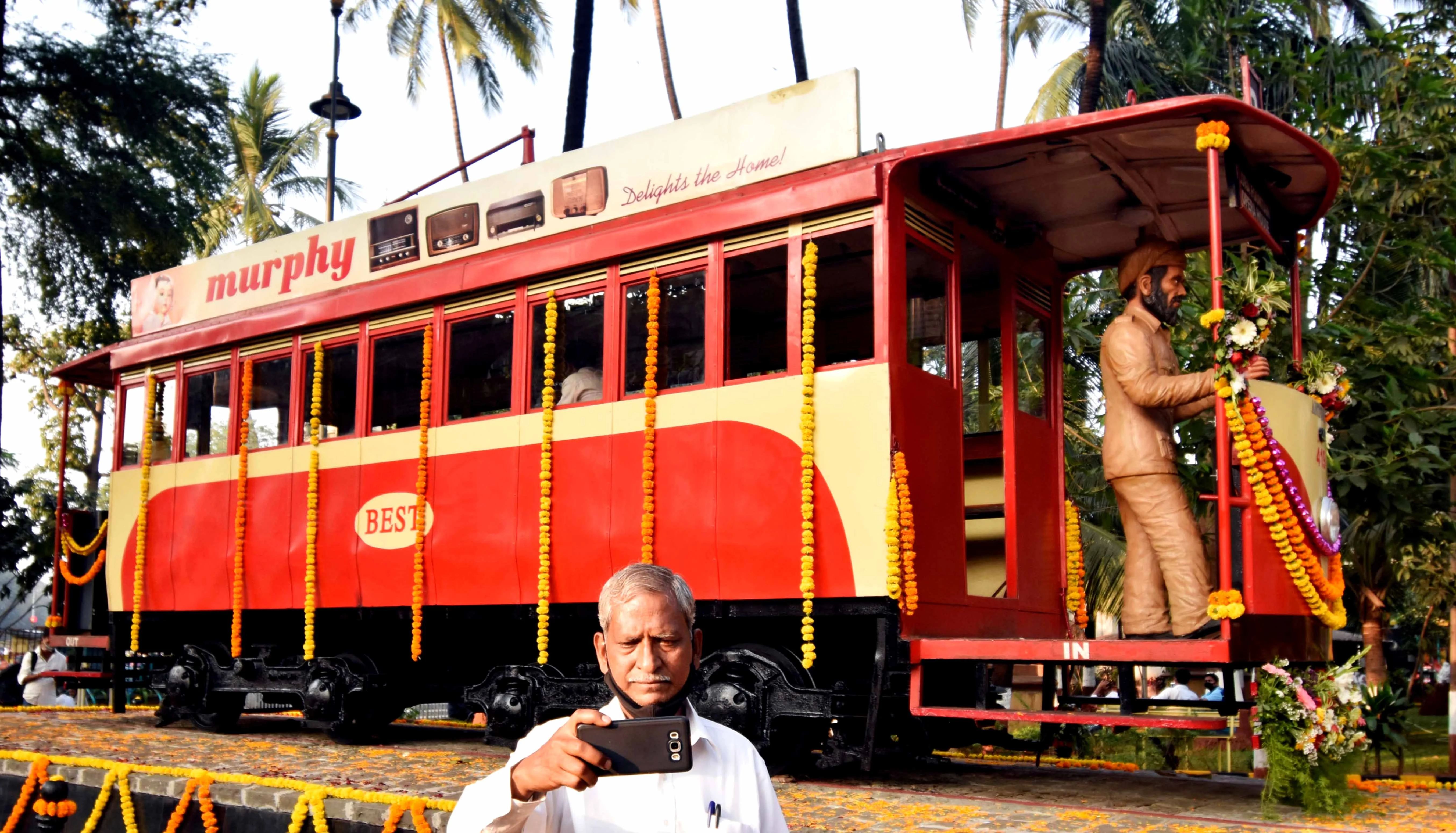 Mumbai: Visitors click selfies in front of a century-old tram bogie, inaugurated by BMC, at Bhatia Baug near CSMT in Mumbai, Thursday, Feb. 25, 2021.